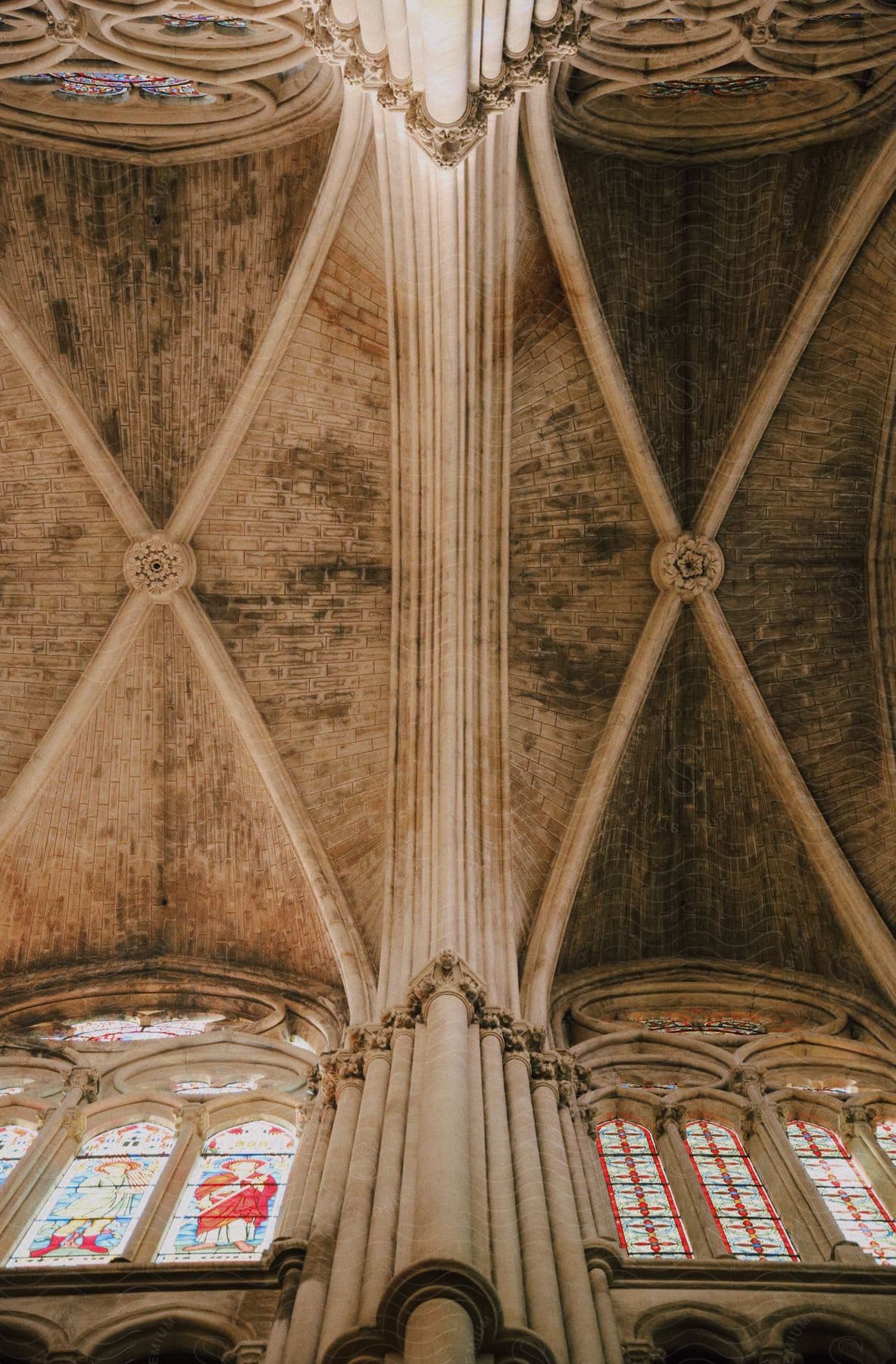 The ceiling and frescoed windows of the medieval church.