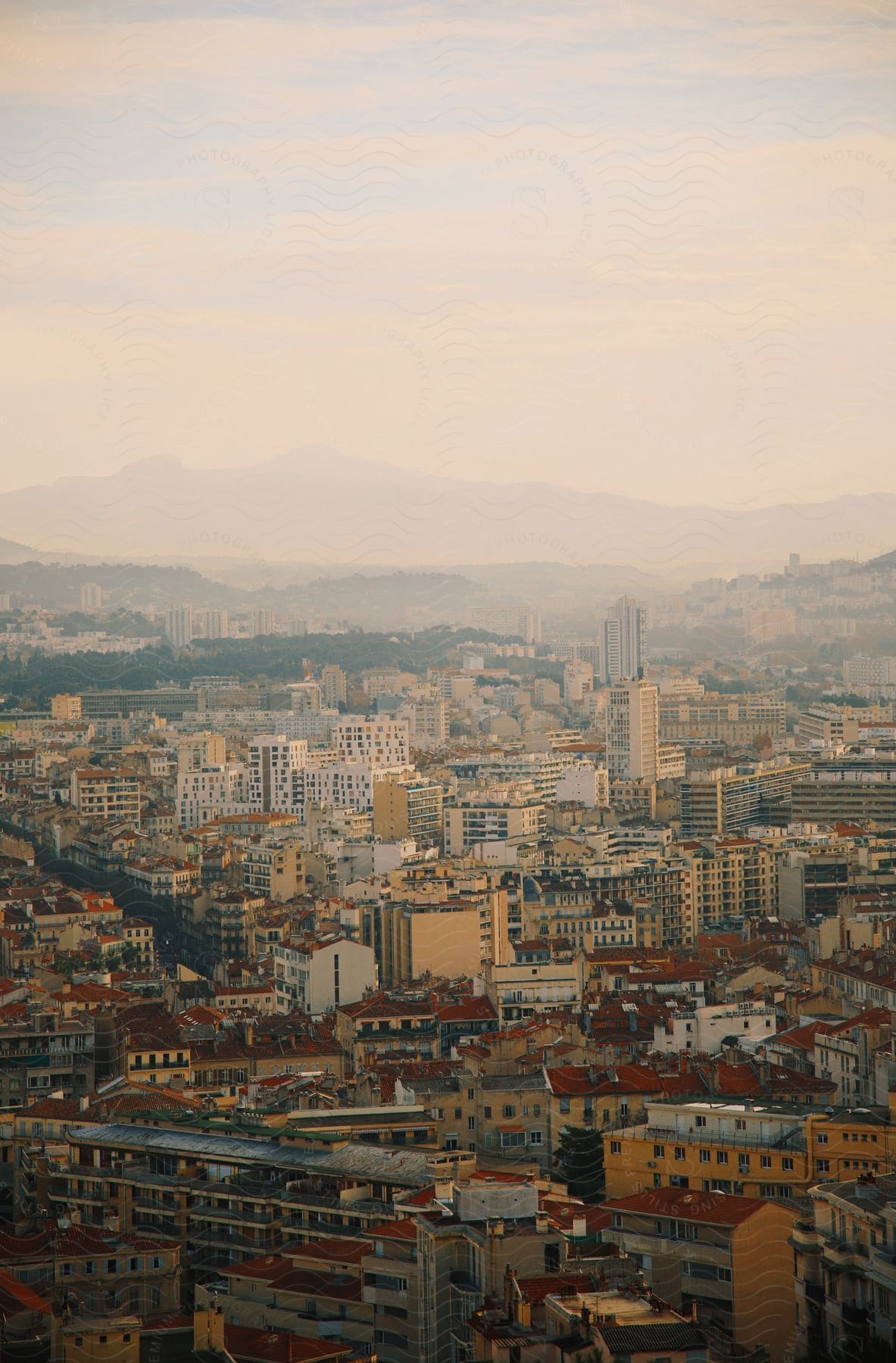 Red Roofed City Covered In Smog, Mountain On Horizon