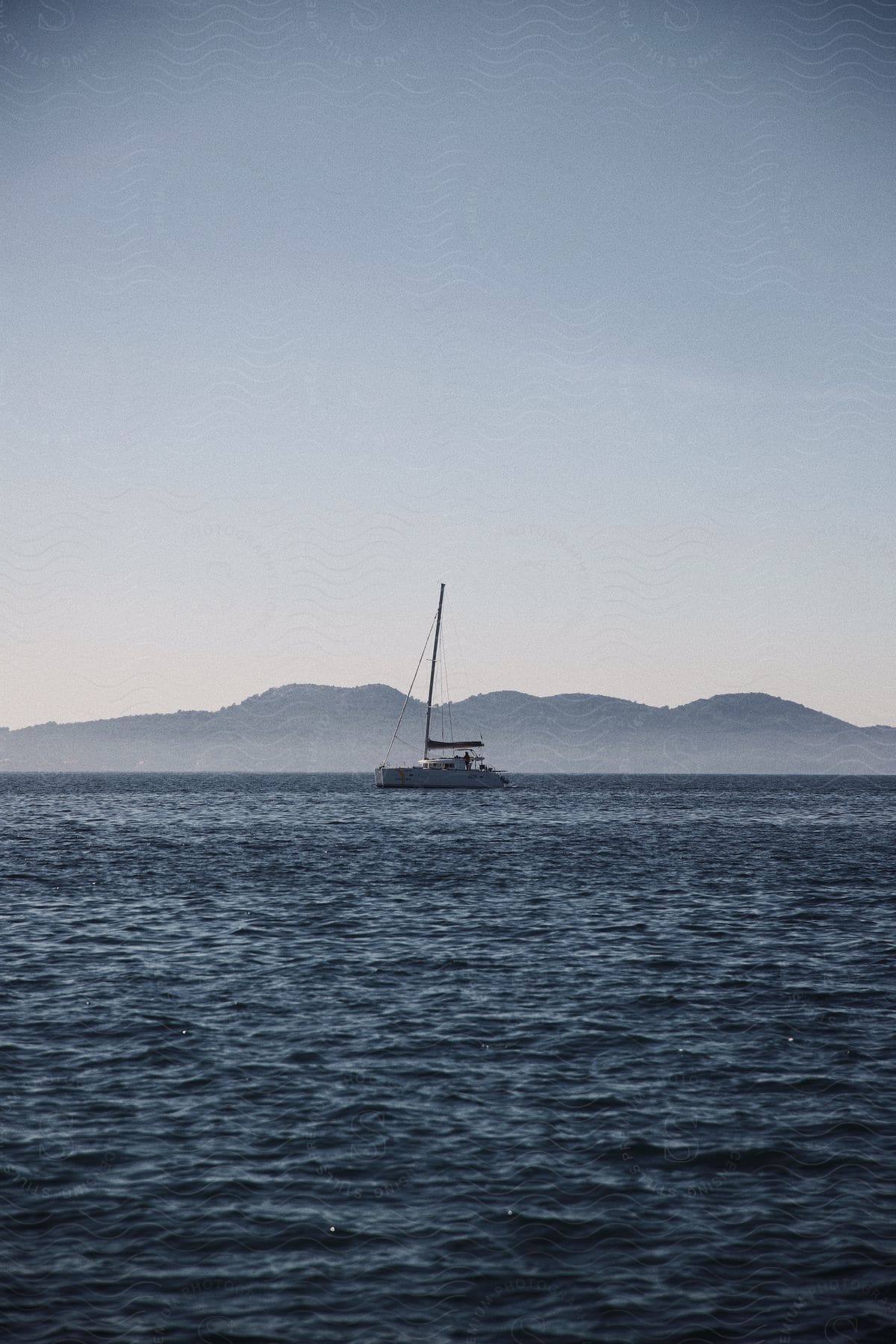 View of the sea with a boat in the background.