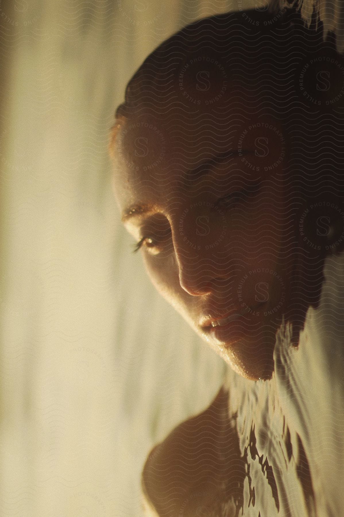 A woman swimming in water on a sunny day.