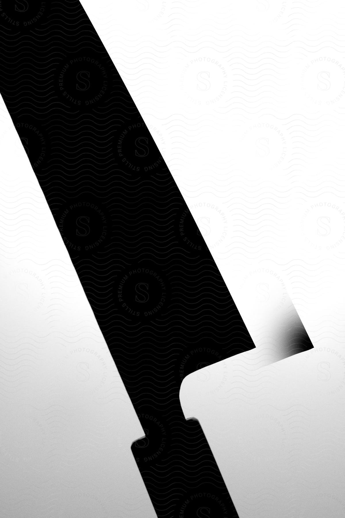 a knife in a dark mode with a white background