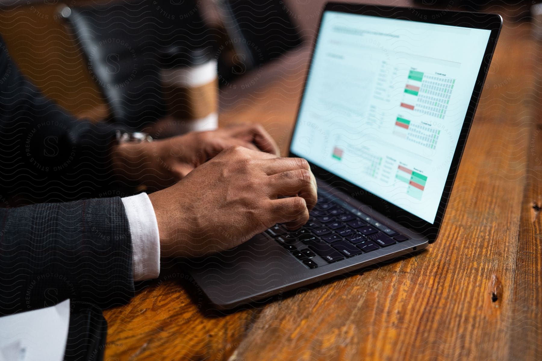 A man is sitting tying on his computer.