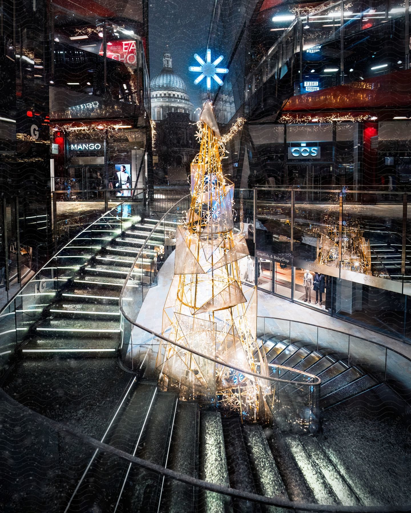 The architectural design inside One New Change, London, featuring the reflection of St. Paul's Cathedral in the plate glass.