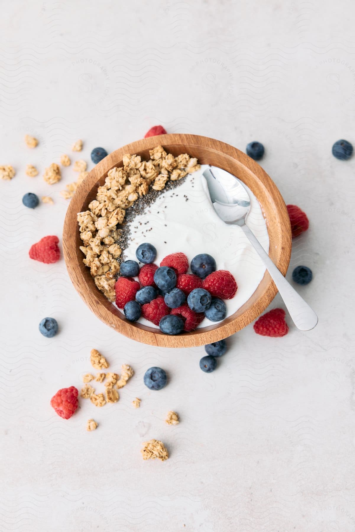 A bowl of yoghurt berries and granola.