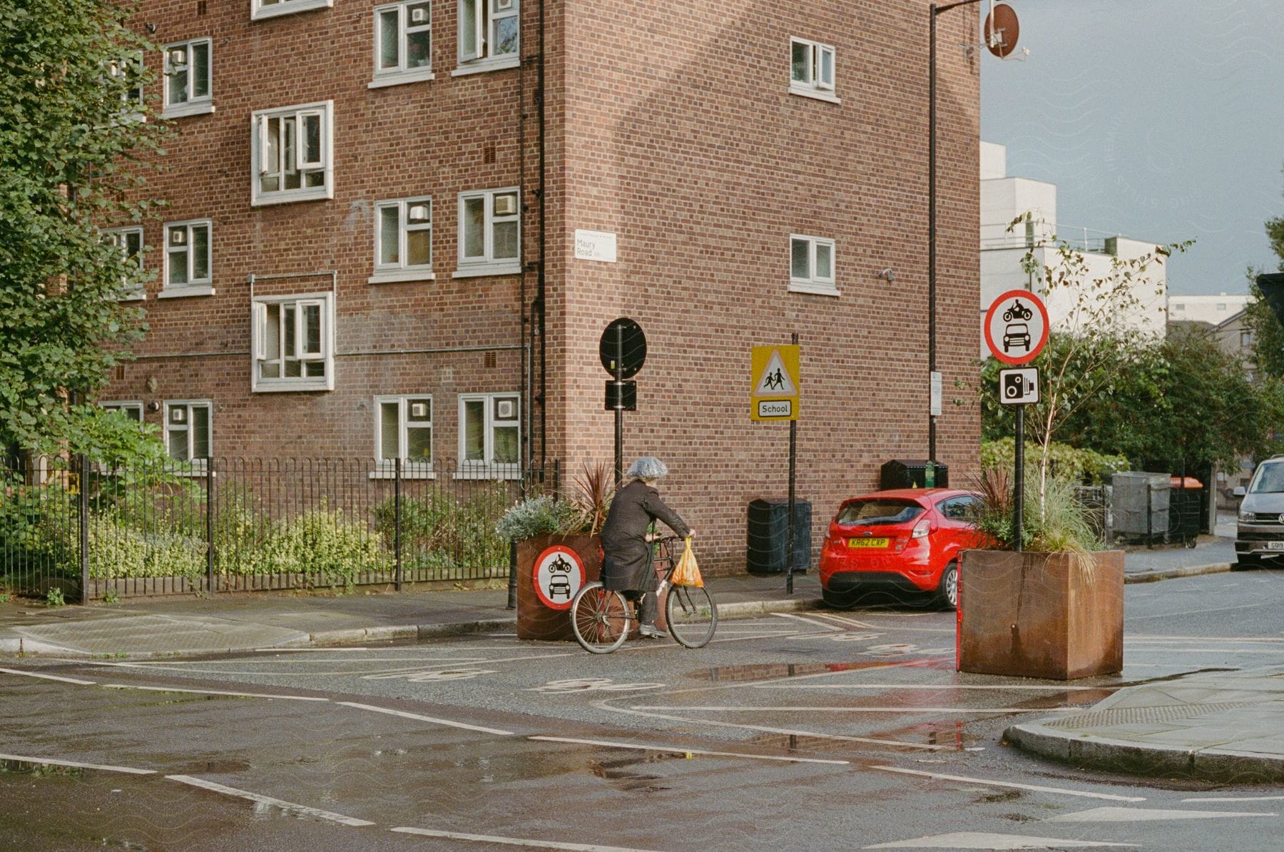 A person riding a bicycle in a large city.