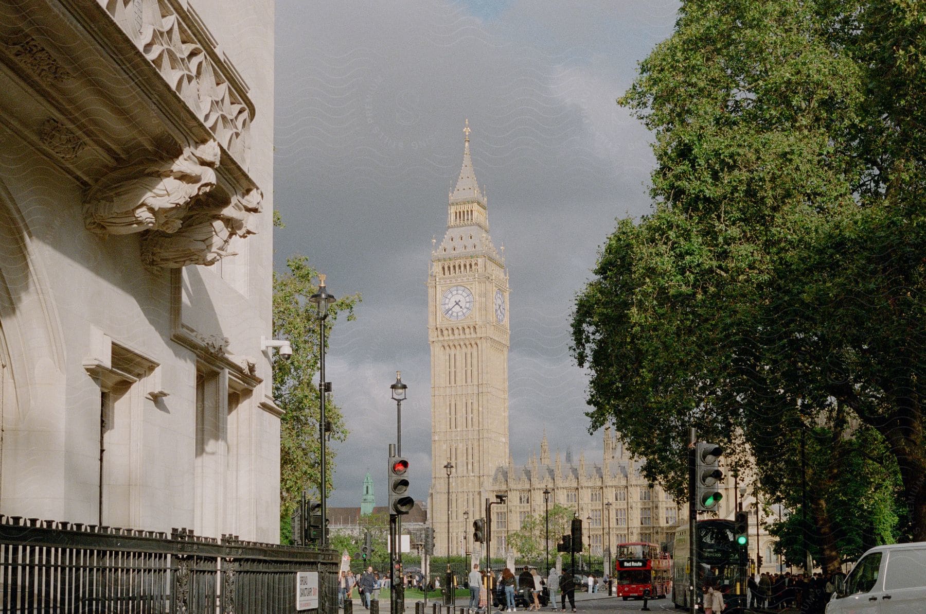 A group of people standing in front of Big Ben, in London.