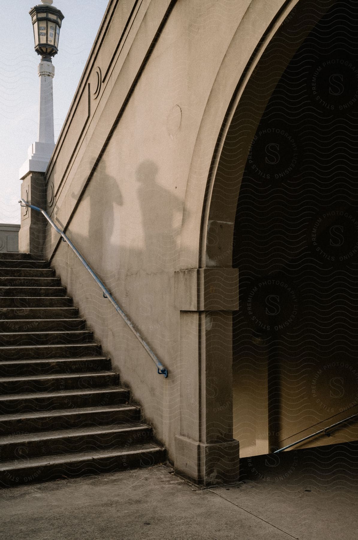 Stairs leading down to a subway tunnel.