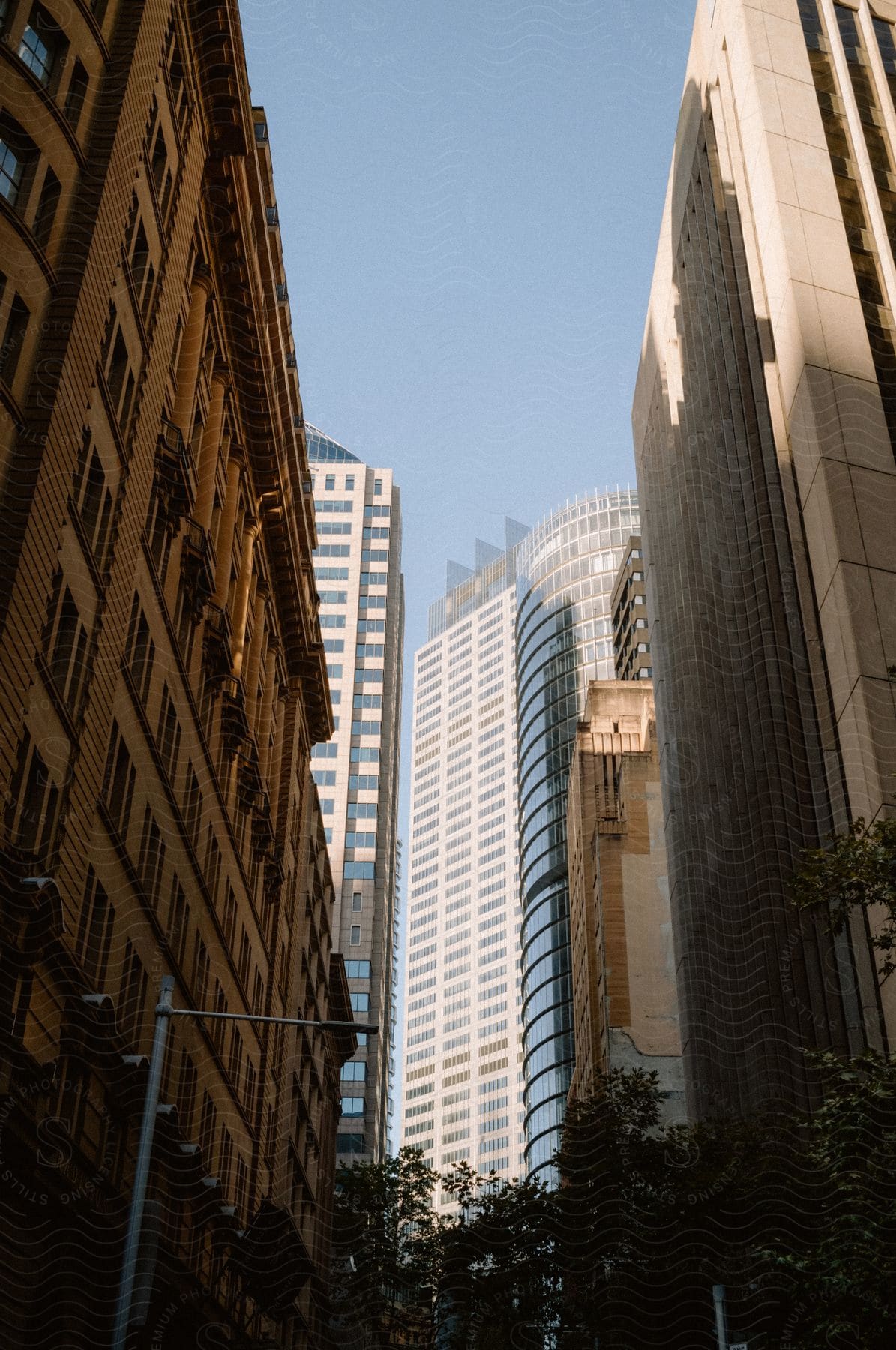 Some tall buildings in a city on a sunny day