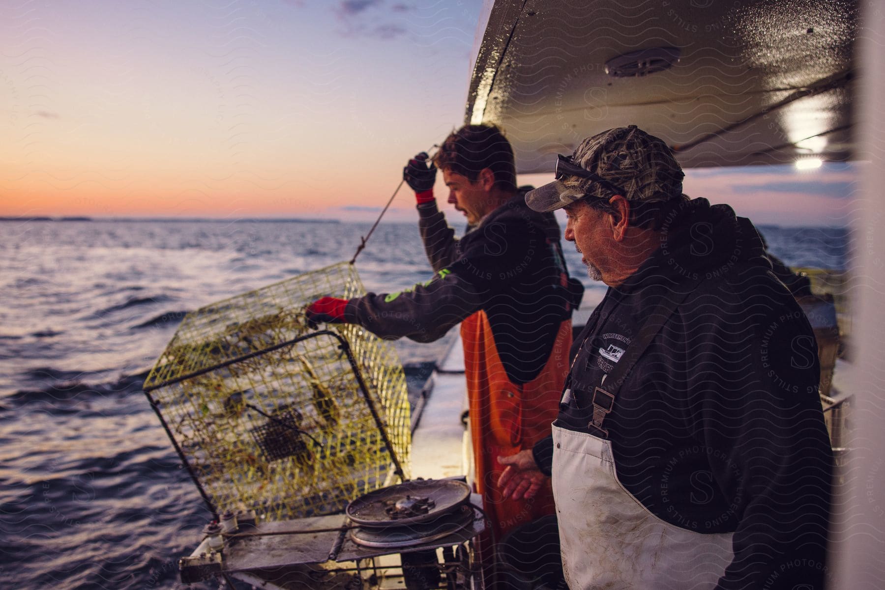 A Fisherman Pulls A Crab Cage Overflowing, Stock Image 242834