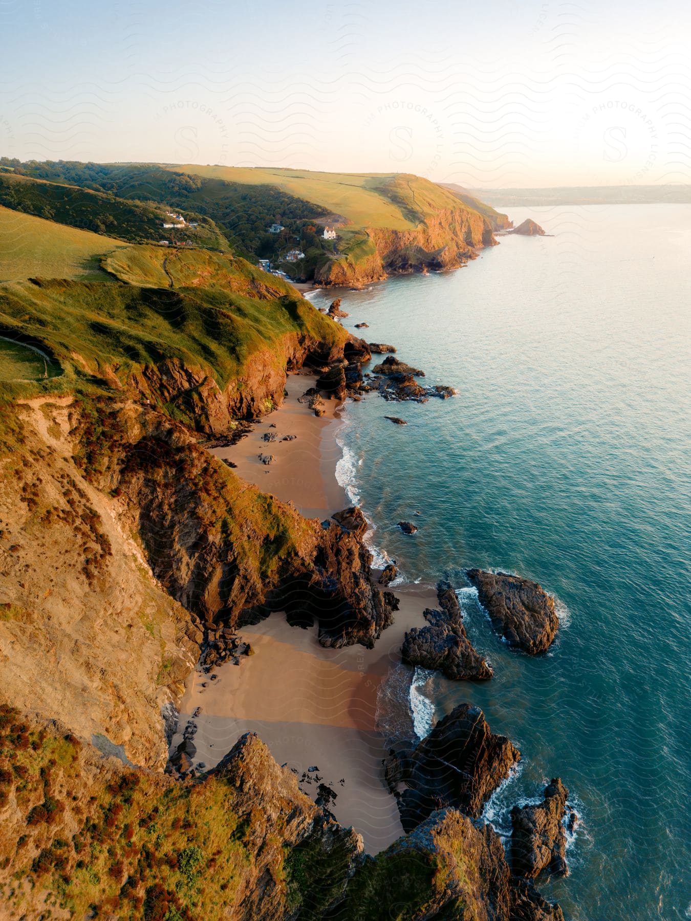 Aerial panorama of the sea and coastline on cliffs in the morning.