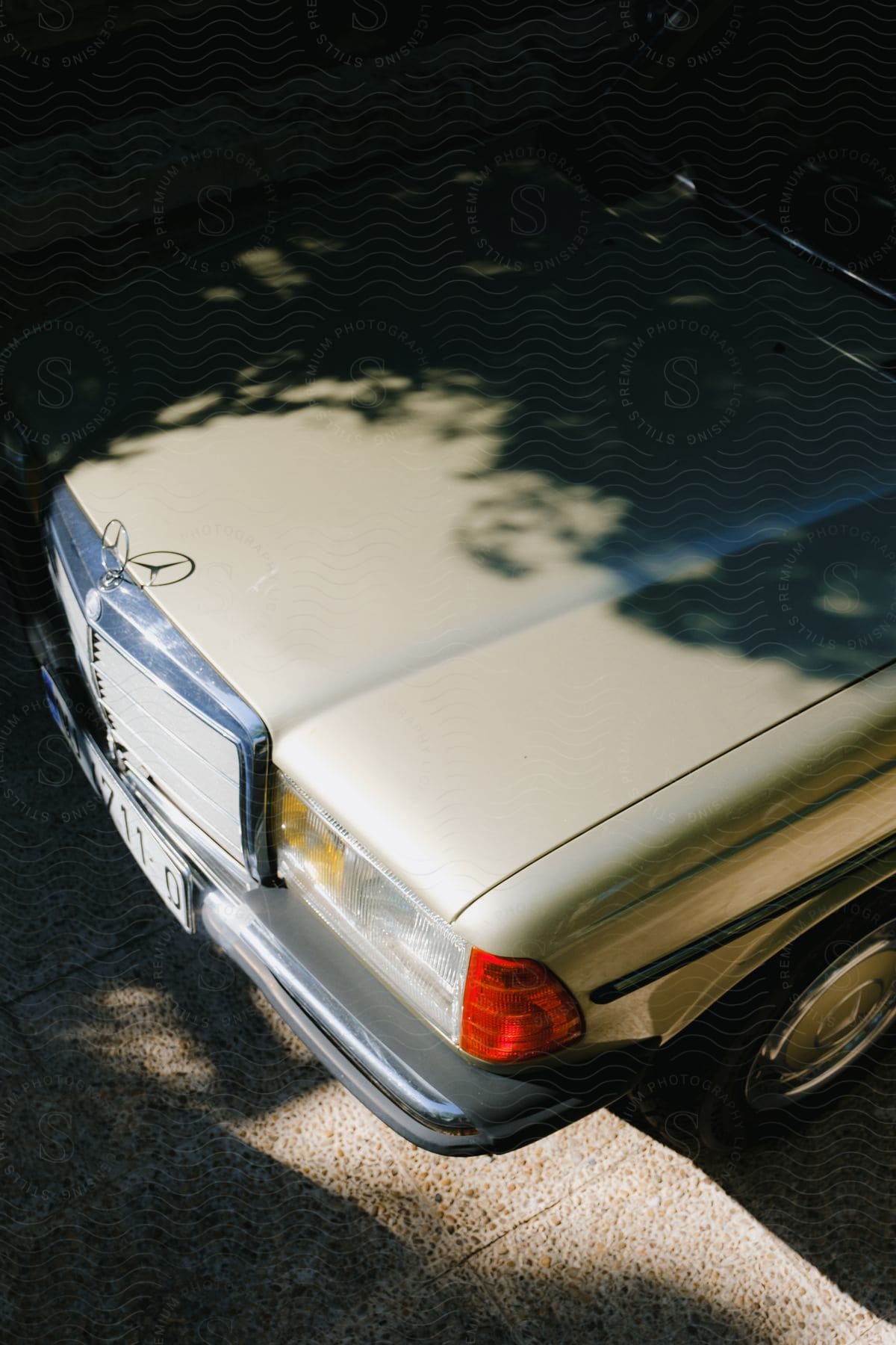 A close-up of the hood of a Mercedes-Benz car