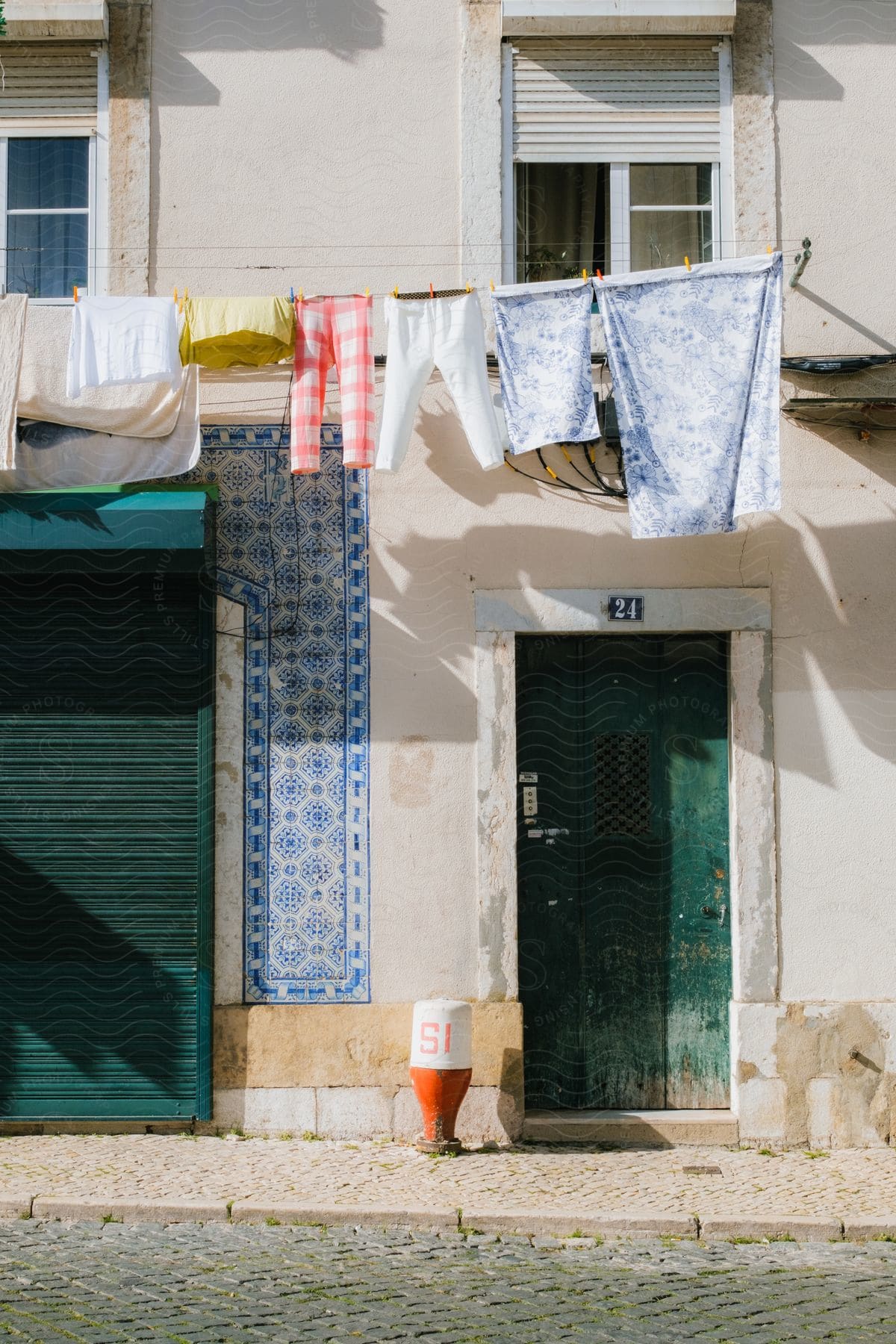 Some Clothes Hanging And Drying In Front Of A House In A City