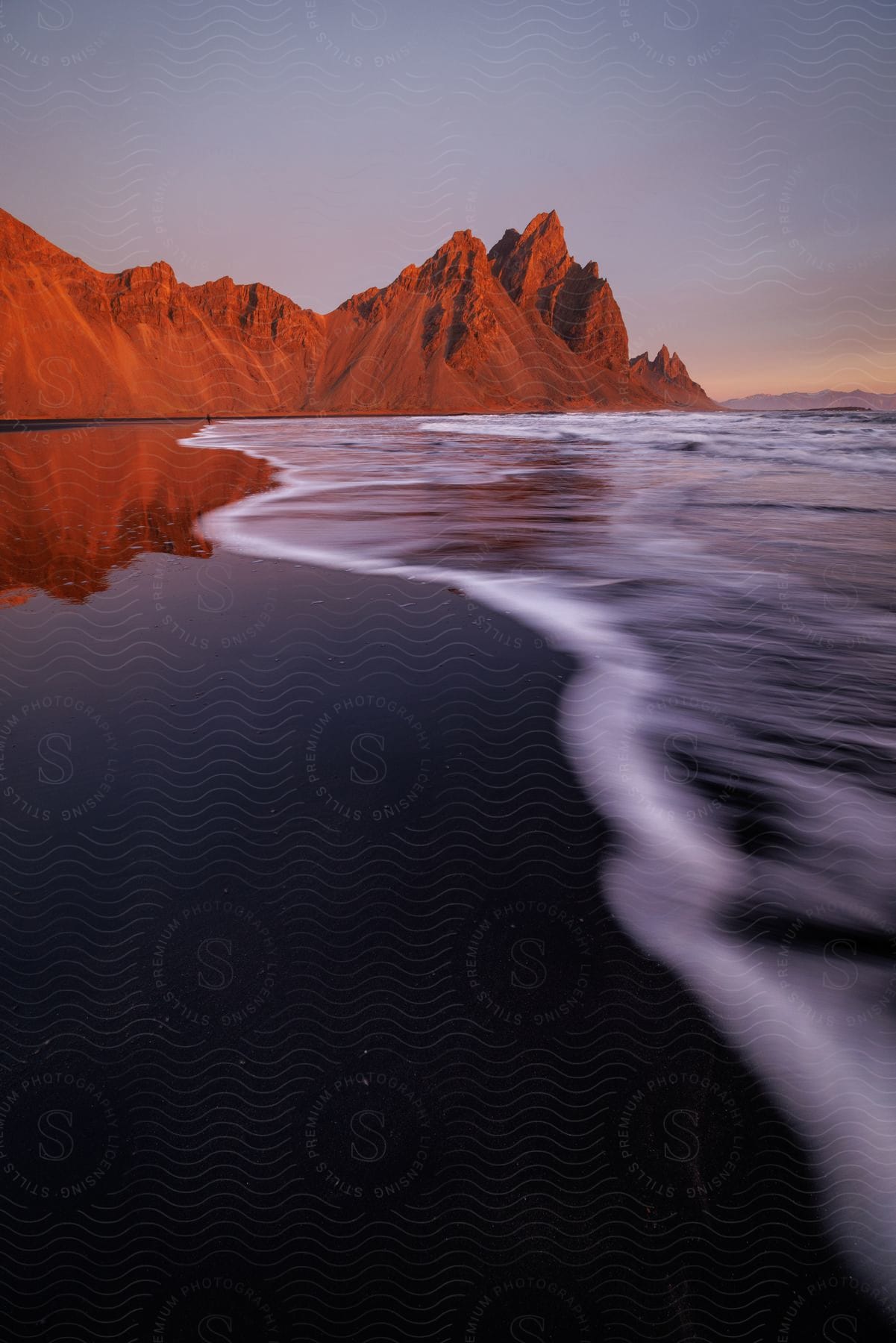 A view of water rolling onto the ocean at the beach.