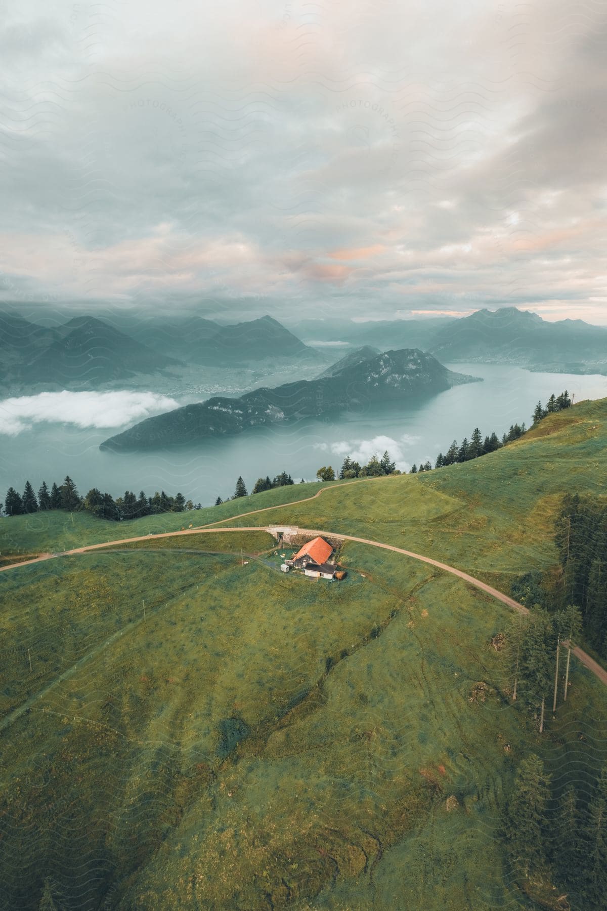 Country house off a road on a hilltop overlooking a mountain river valley