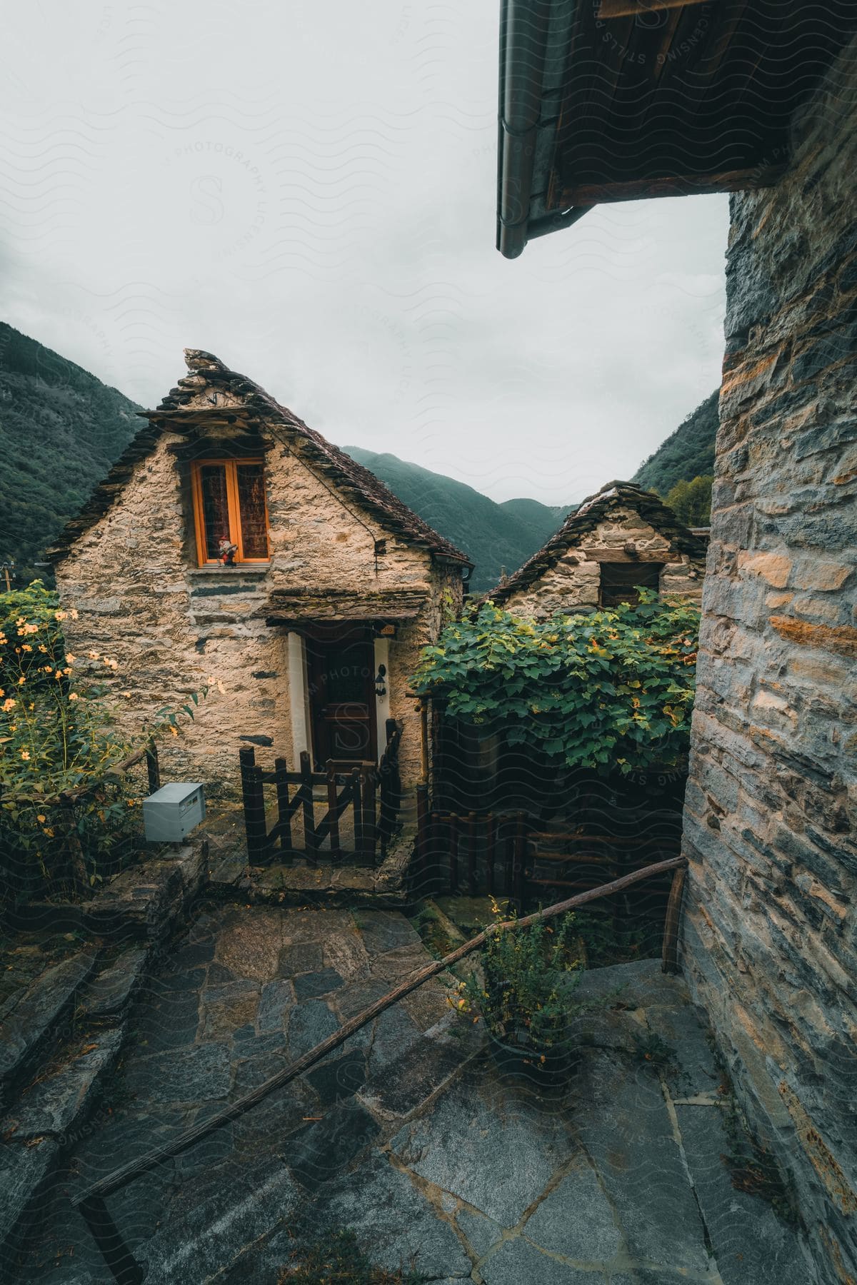 buildings surrounded by mountains in a village