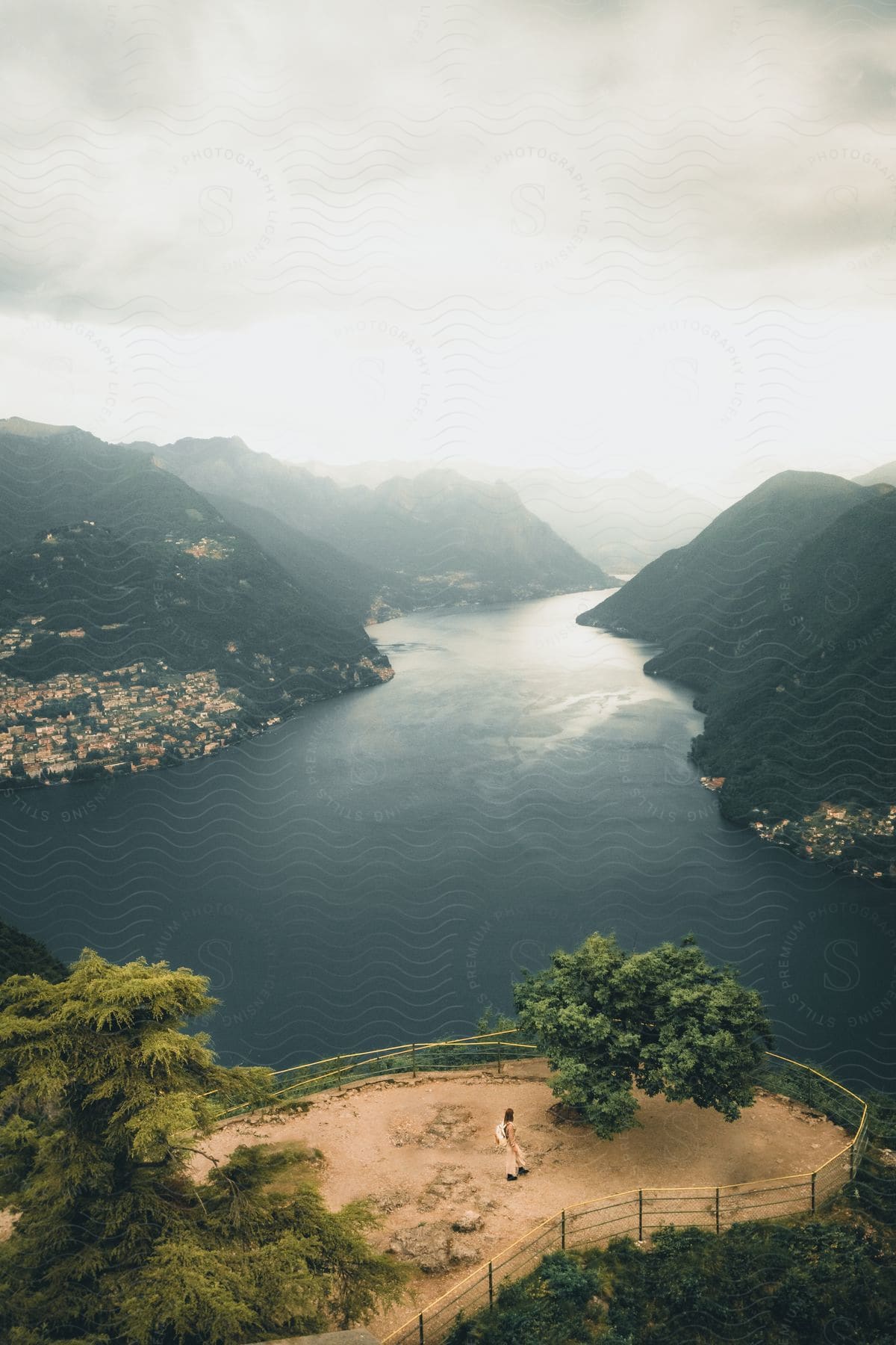 An aerial view capturing the Observatory on top of Monte Salvatore, offering a panoramic vista of Lugano Lake, Monte Bre, Caprino, and the Swiss-Italian borderline.