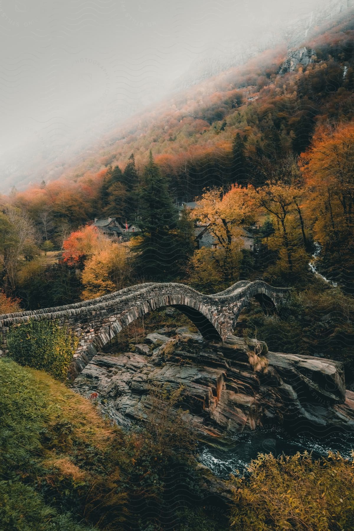 Skyline of a stone bridge in a small village in the mountains.