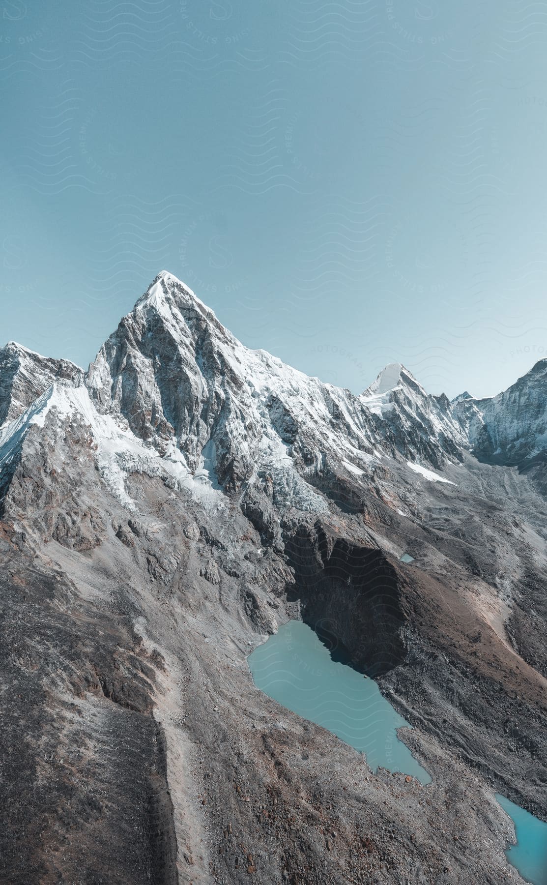 A stream runs through a snow covered mountain