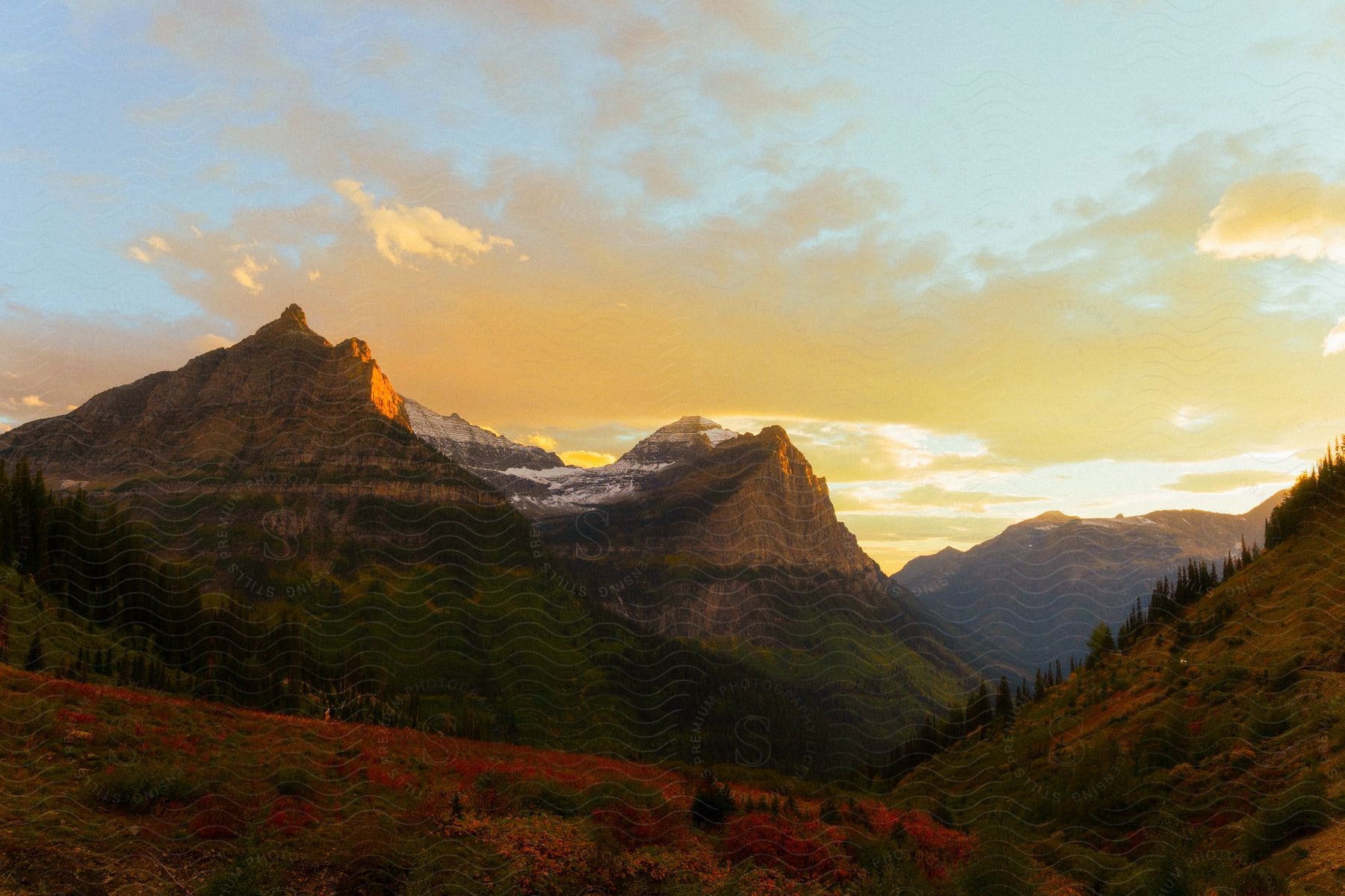 A view of mountains in the distance at sunset.