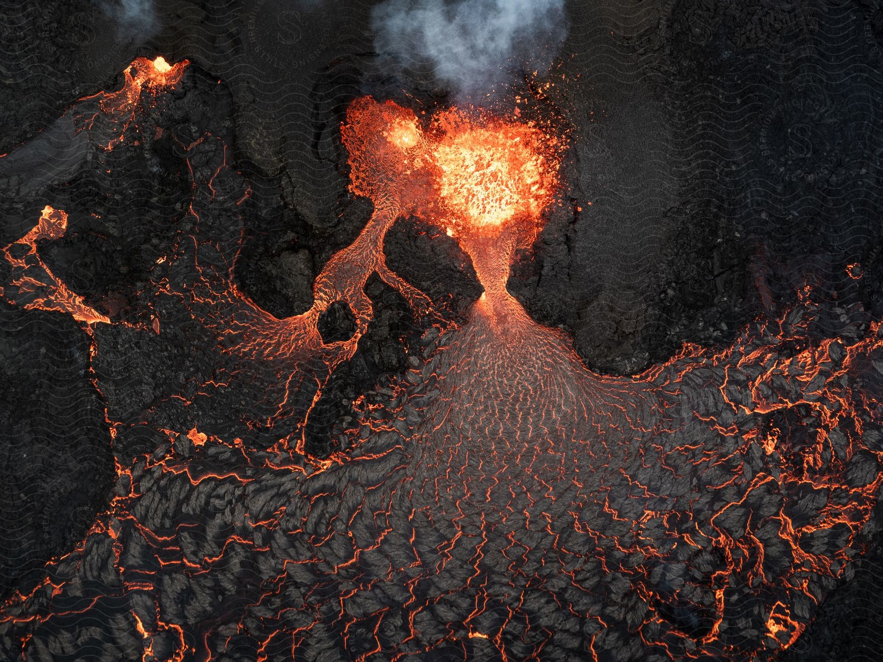 Aerial of lava from an erupting volcano.