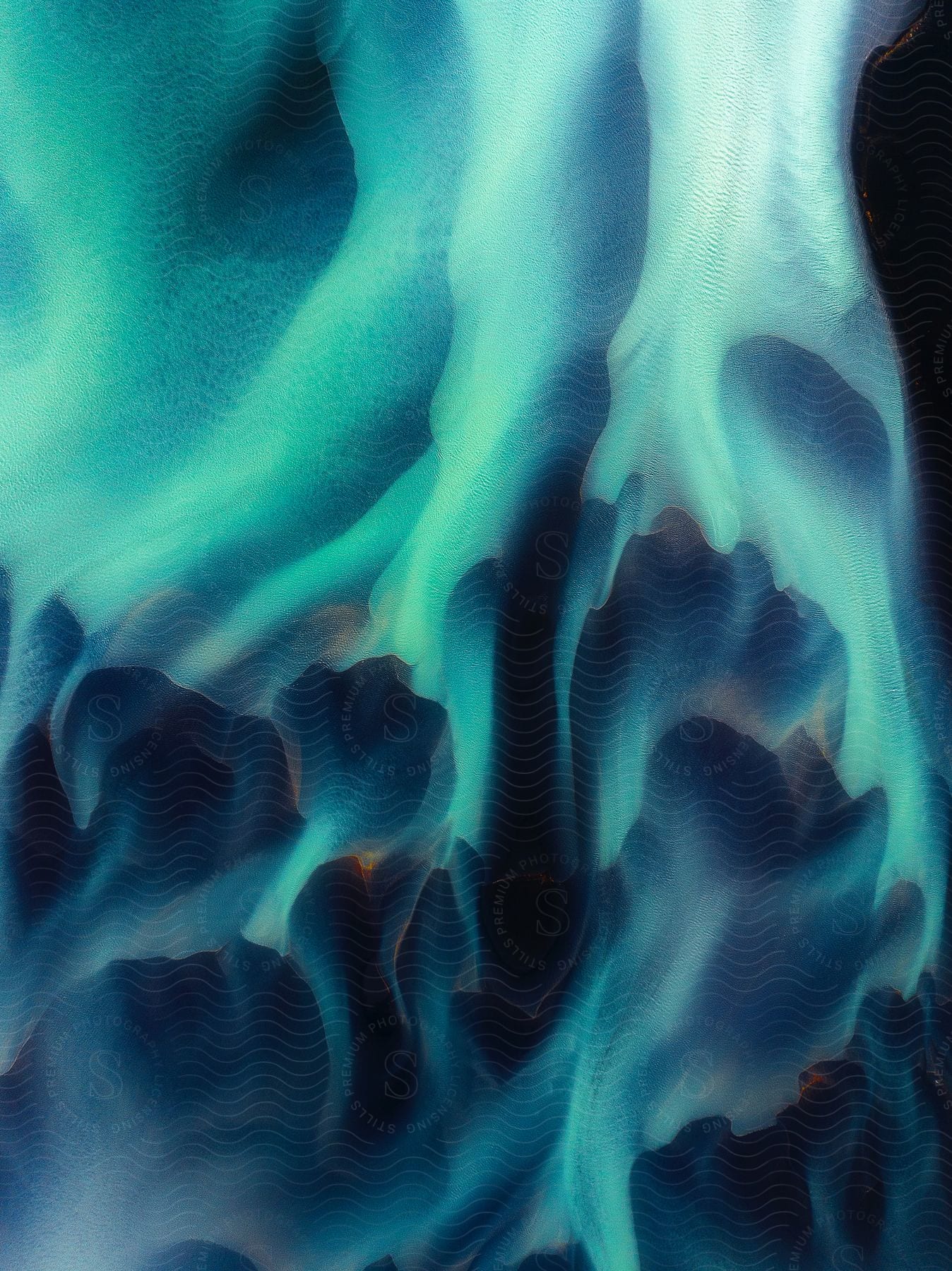 Stock photo of aerial view of a blue icelandic glacial river