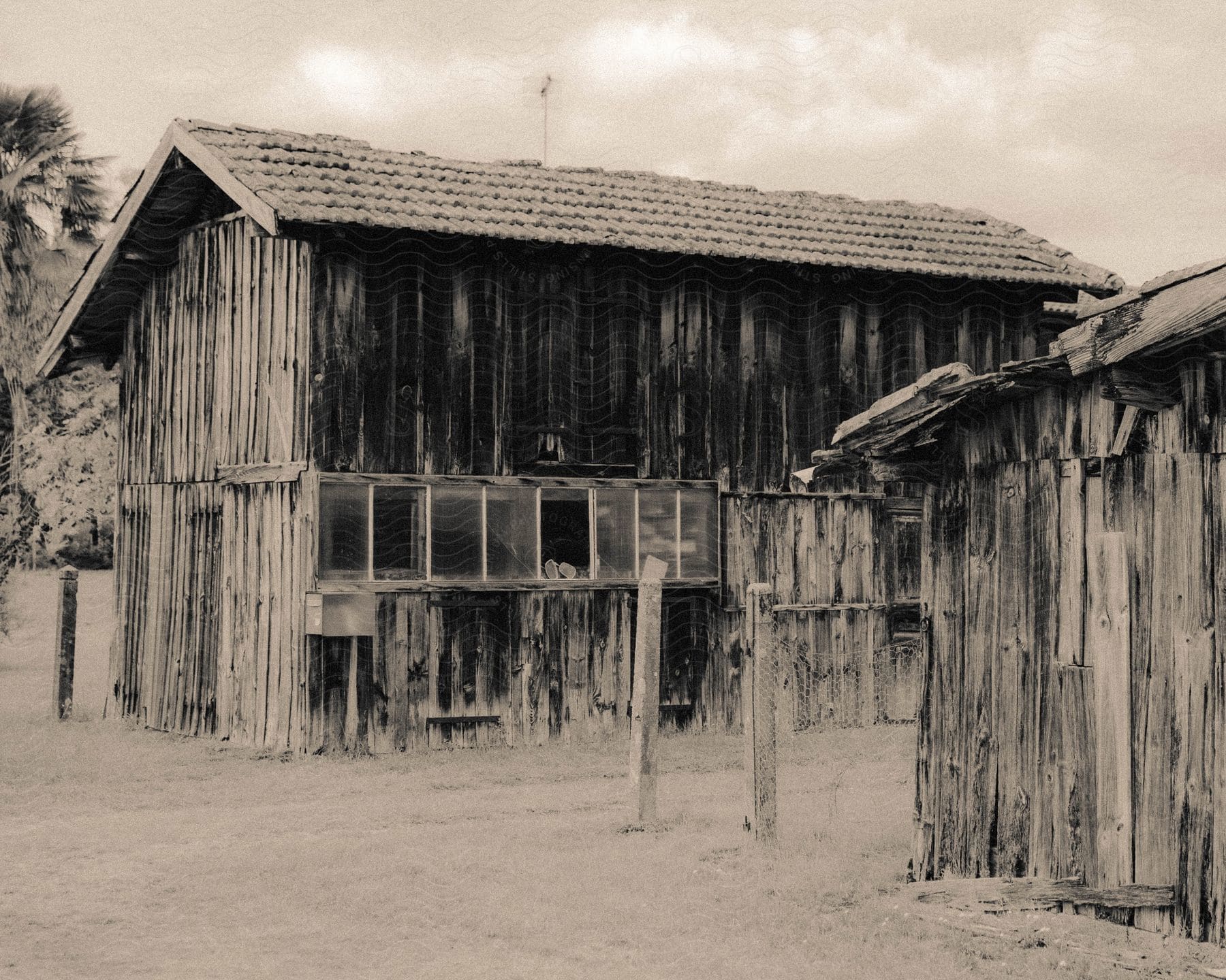 An couple old wooden buildings that are falling apart