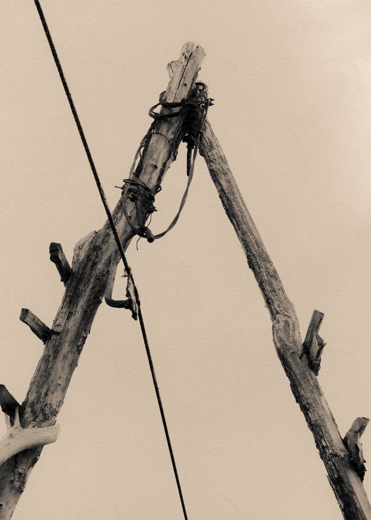 Two wooden slats are connected in a triangular shape