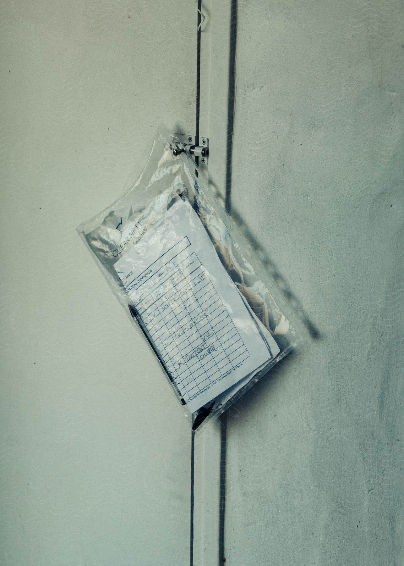 A bag of liquid hanging next to a wall