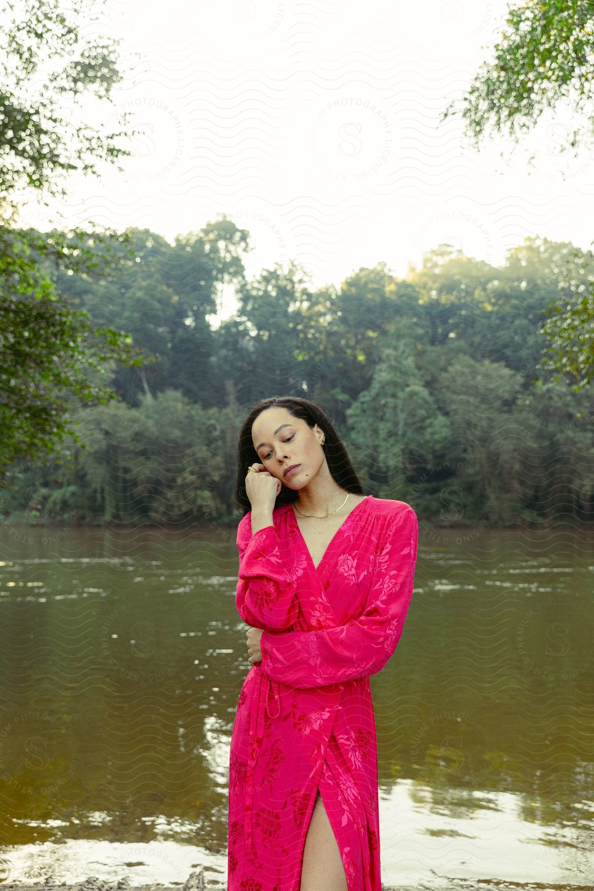 A woman modeling a robe out in nature.