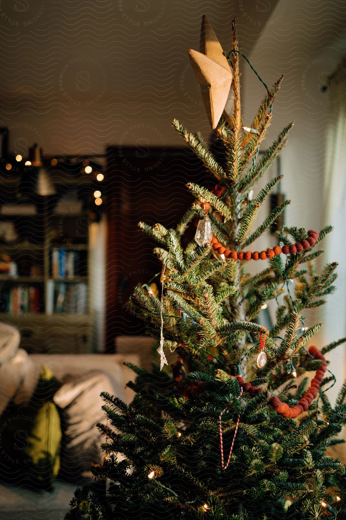 A decorated Christmas tree in a living room.