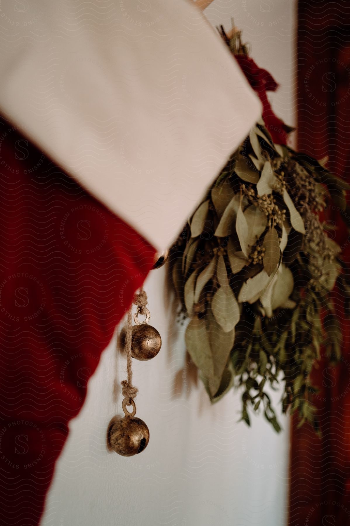 Some Christmas decorations in a room hanging on the wall.