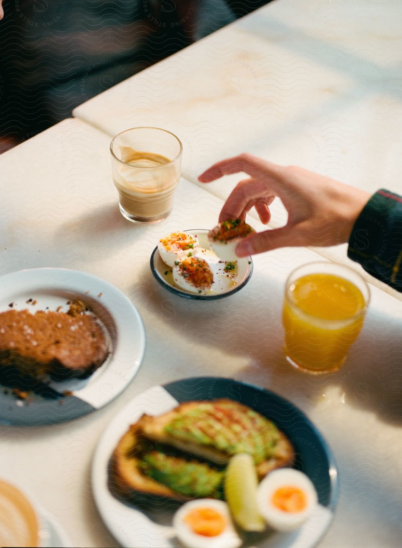 A person enjoying a delicious breakfast.