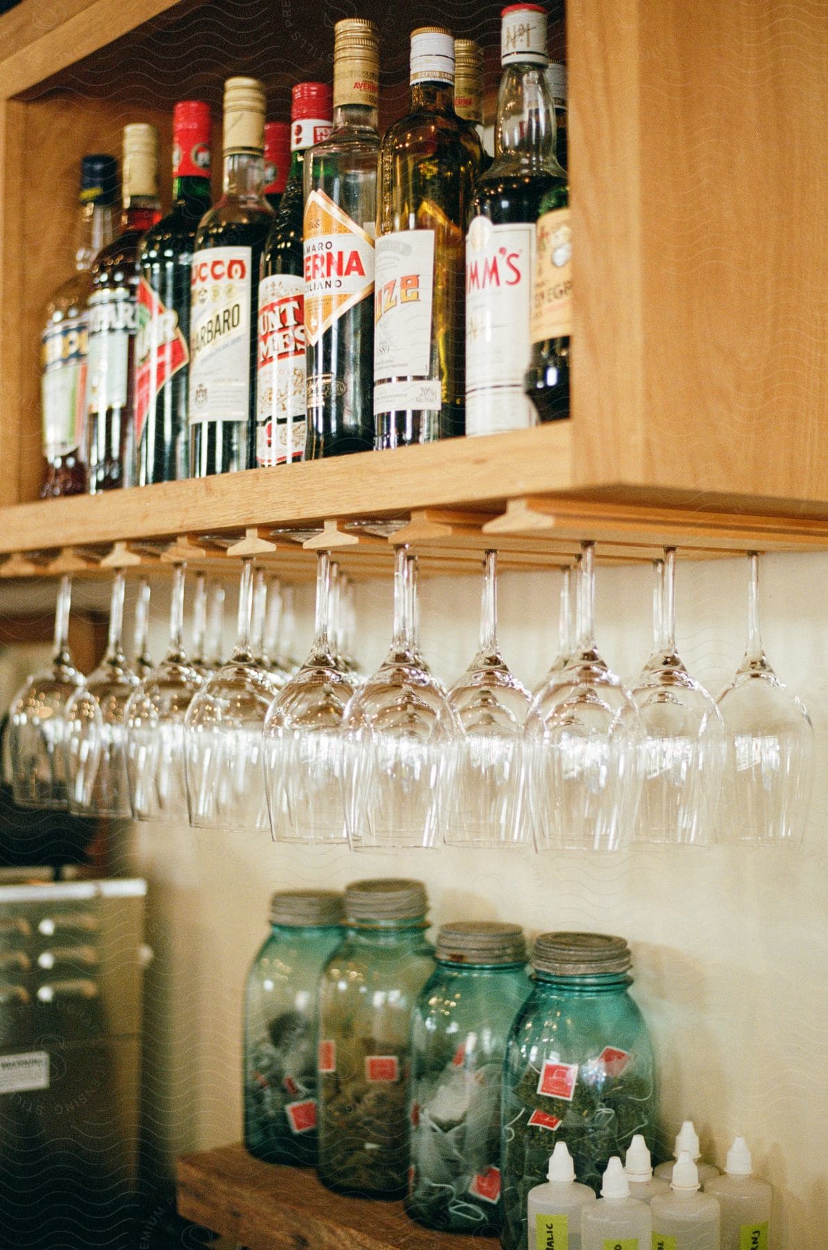 Bottles full of alcohol sitting on a shelf