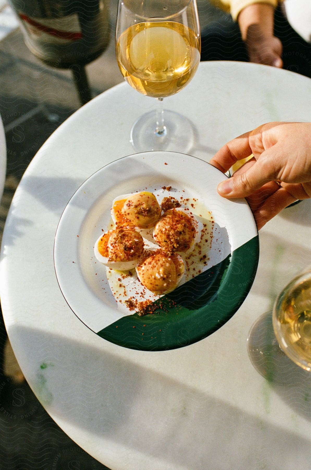 A meal sitting on a plate at an outdoor cafe.