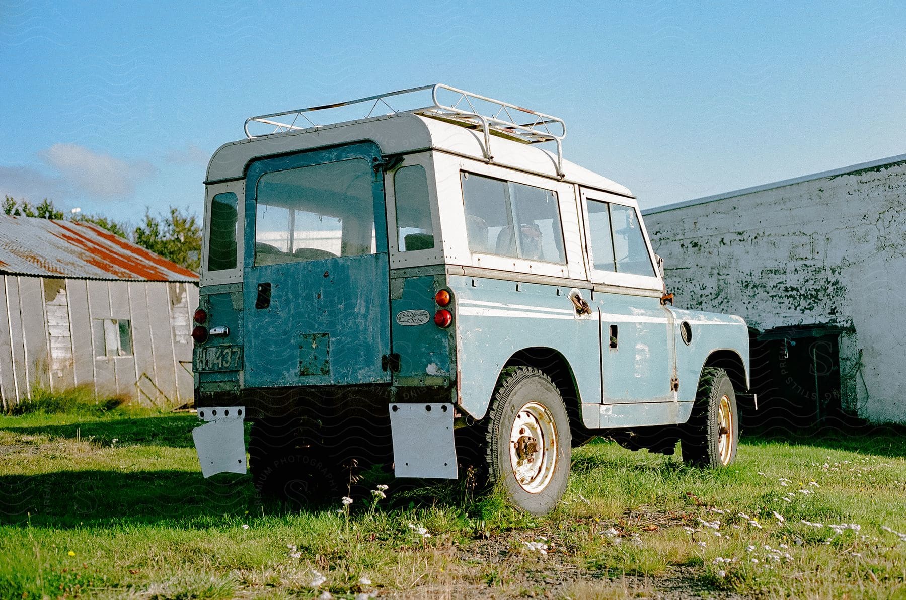 vintage land cruiser truck parked on grass