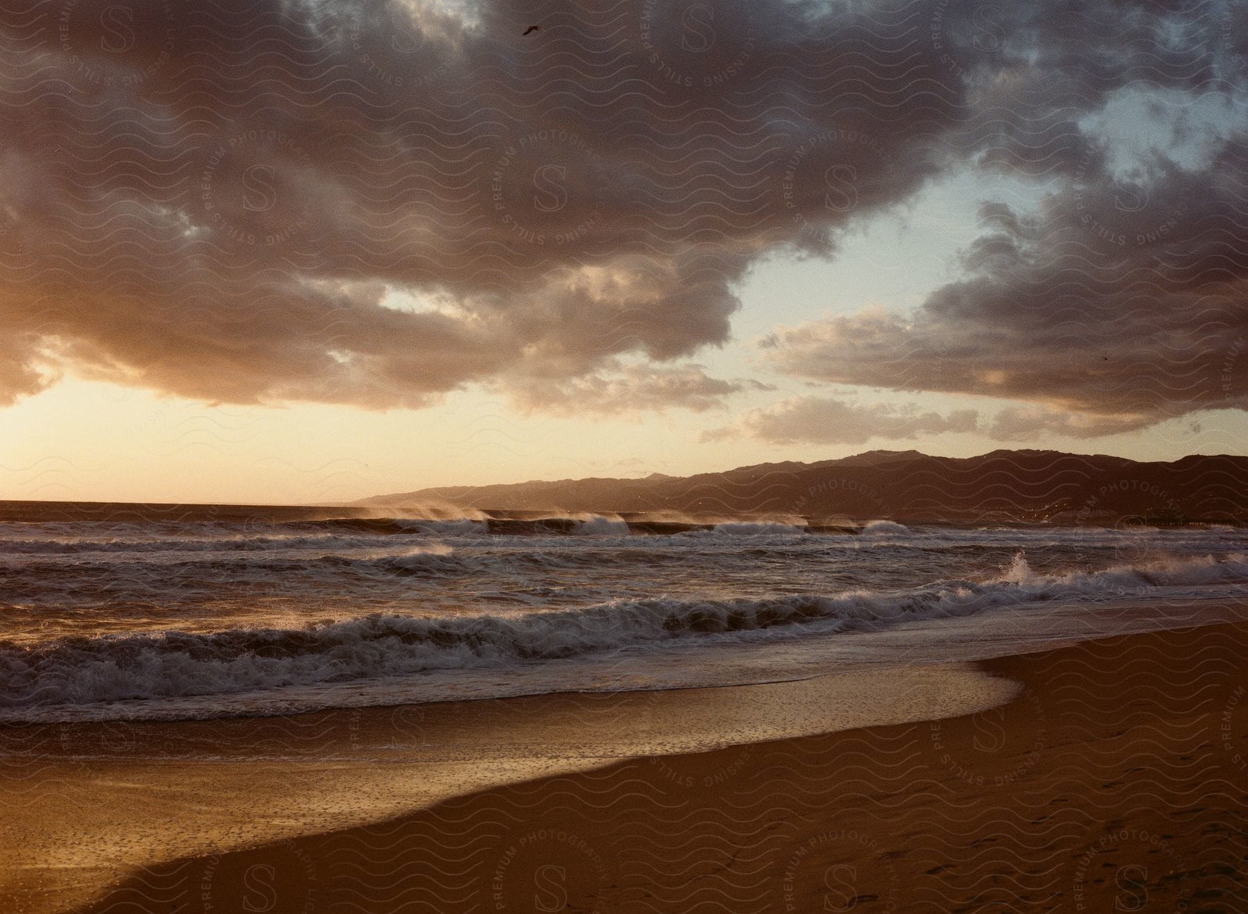 The sea waves break on the beach.