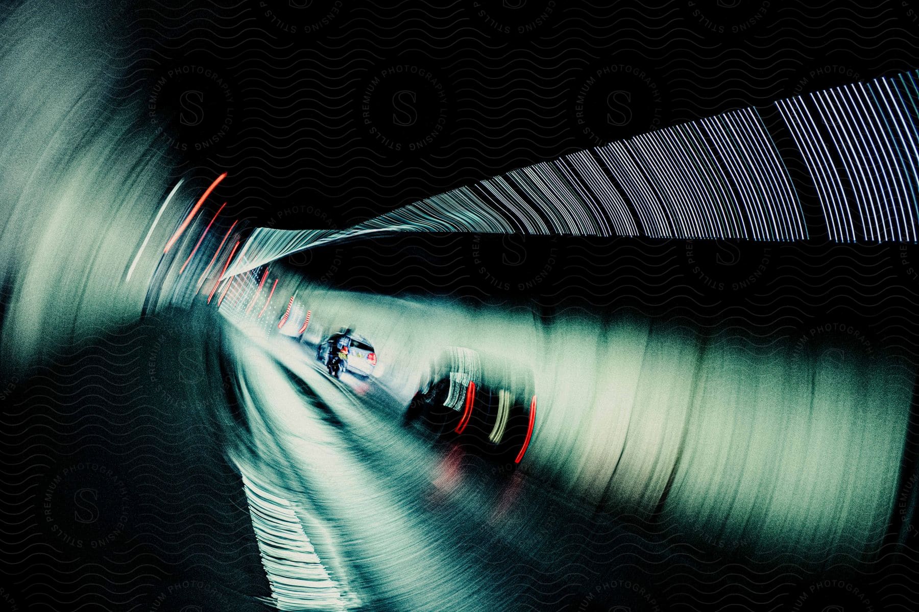 Cars driving through a tunnel at night time