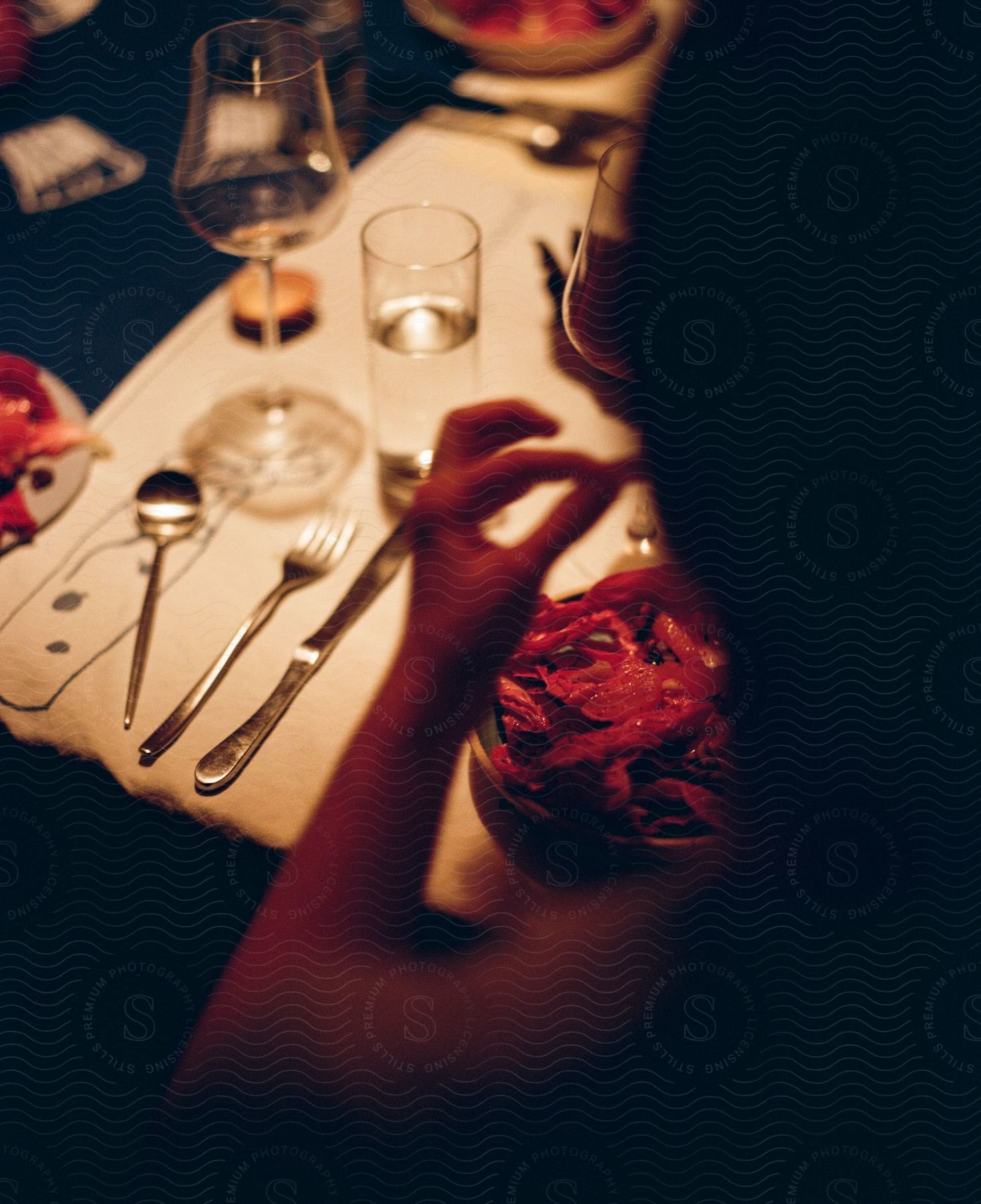 A woman eating food while sitting in a restaurant