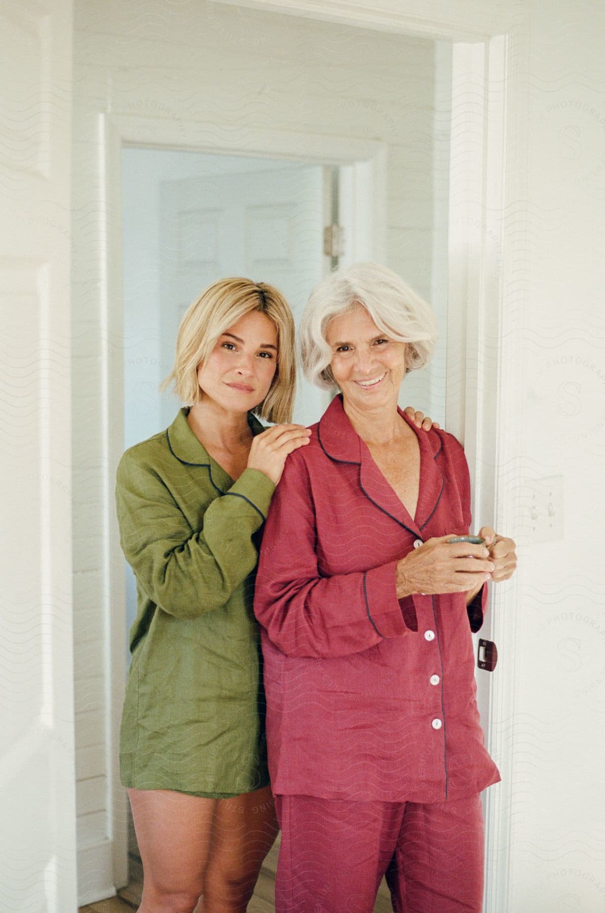 Two women in pajamas posing for the camera