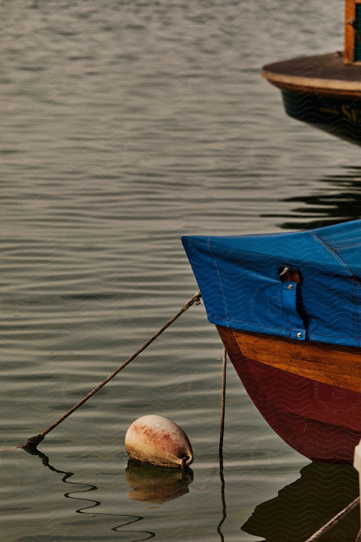 Canoes docked in a calm sea.