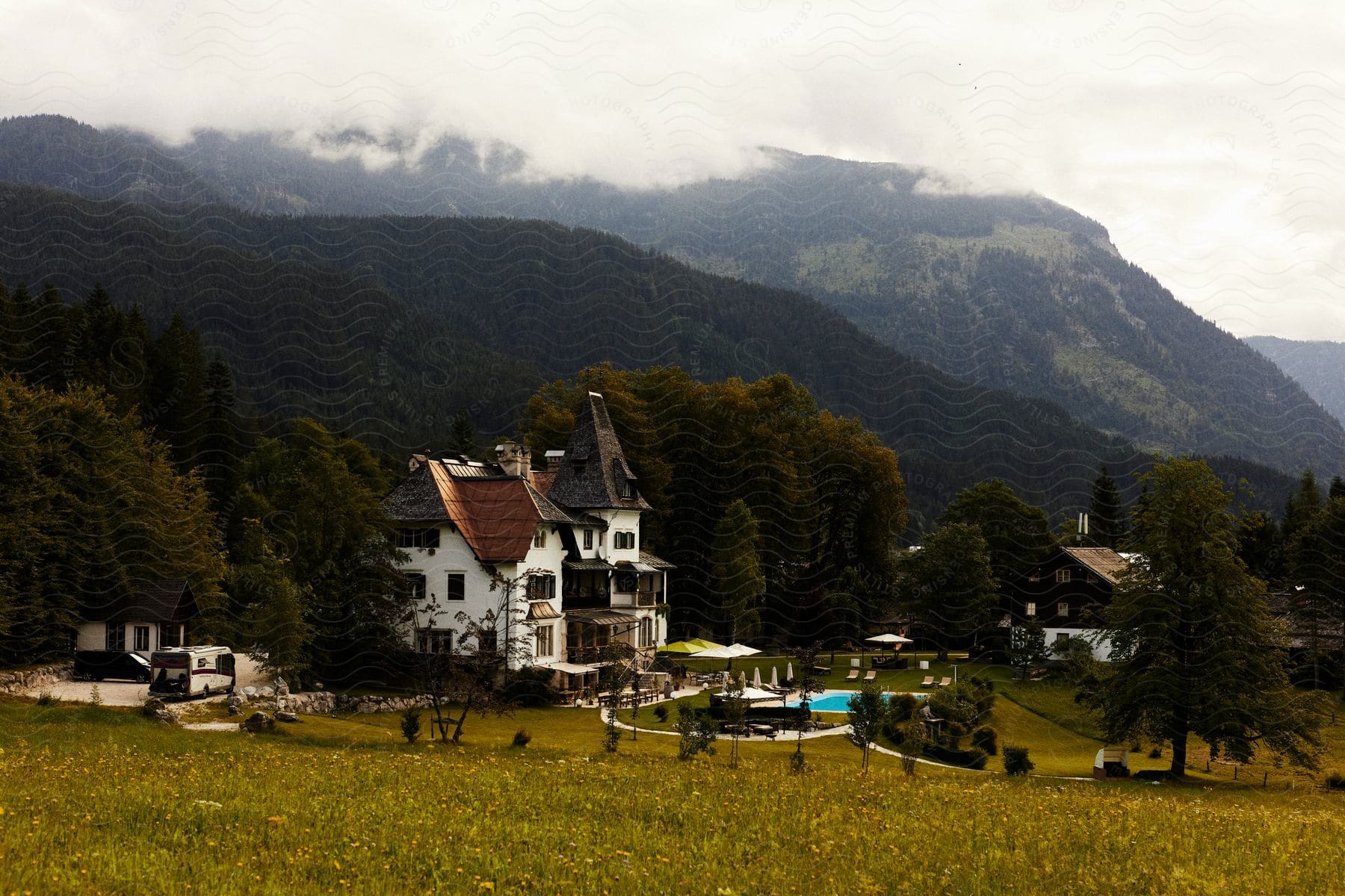 Houses in a small neighborhood at the foot of a forested mountain