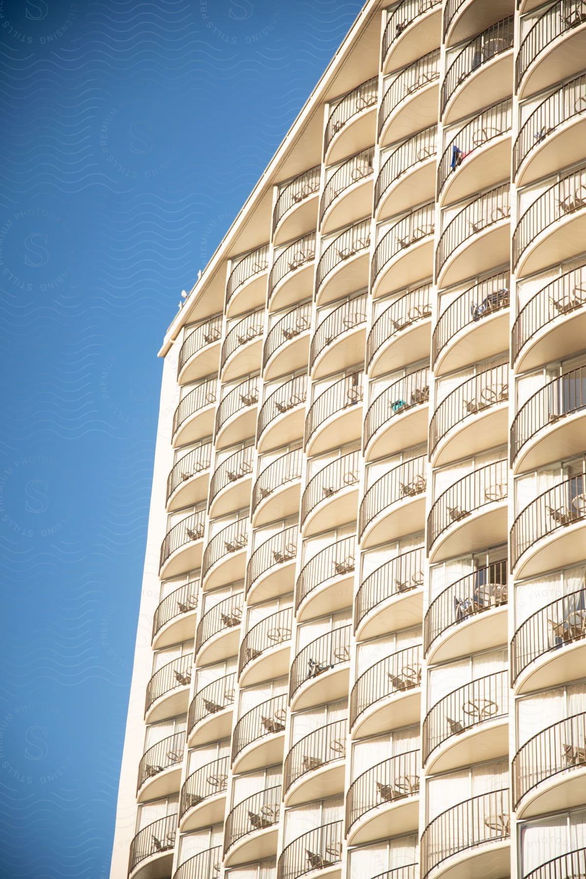 A view of a building with a lot of balconies on it.