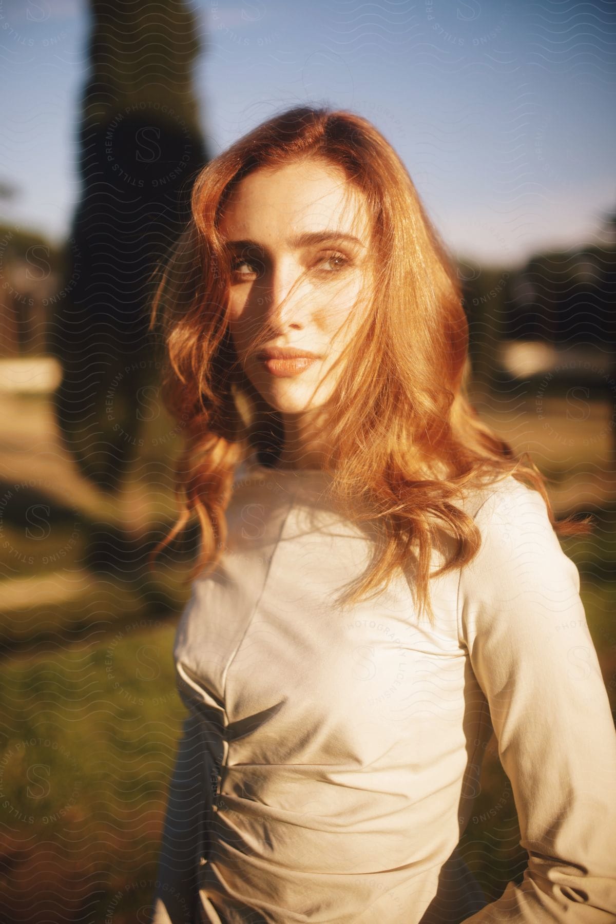 Stock photo of close-up of a woman's face bathed in sunlight.