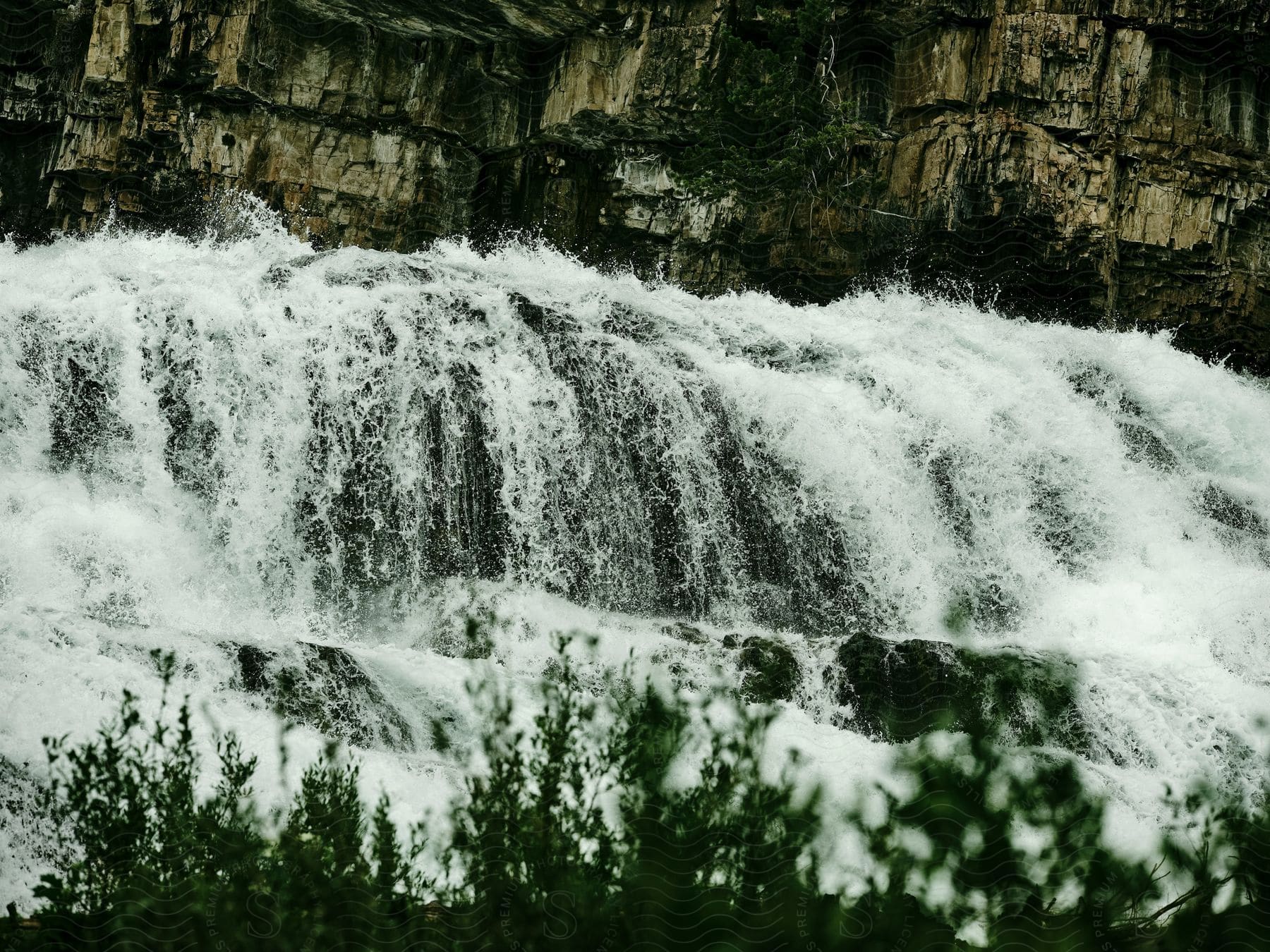 A view of a river flowing over a waterfall