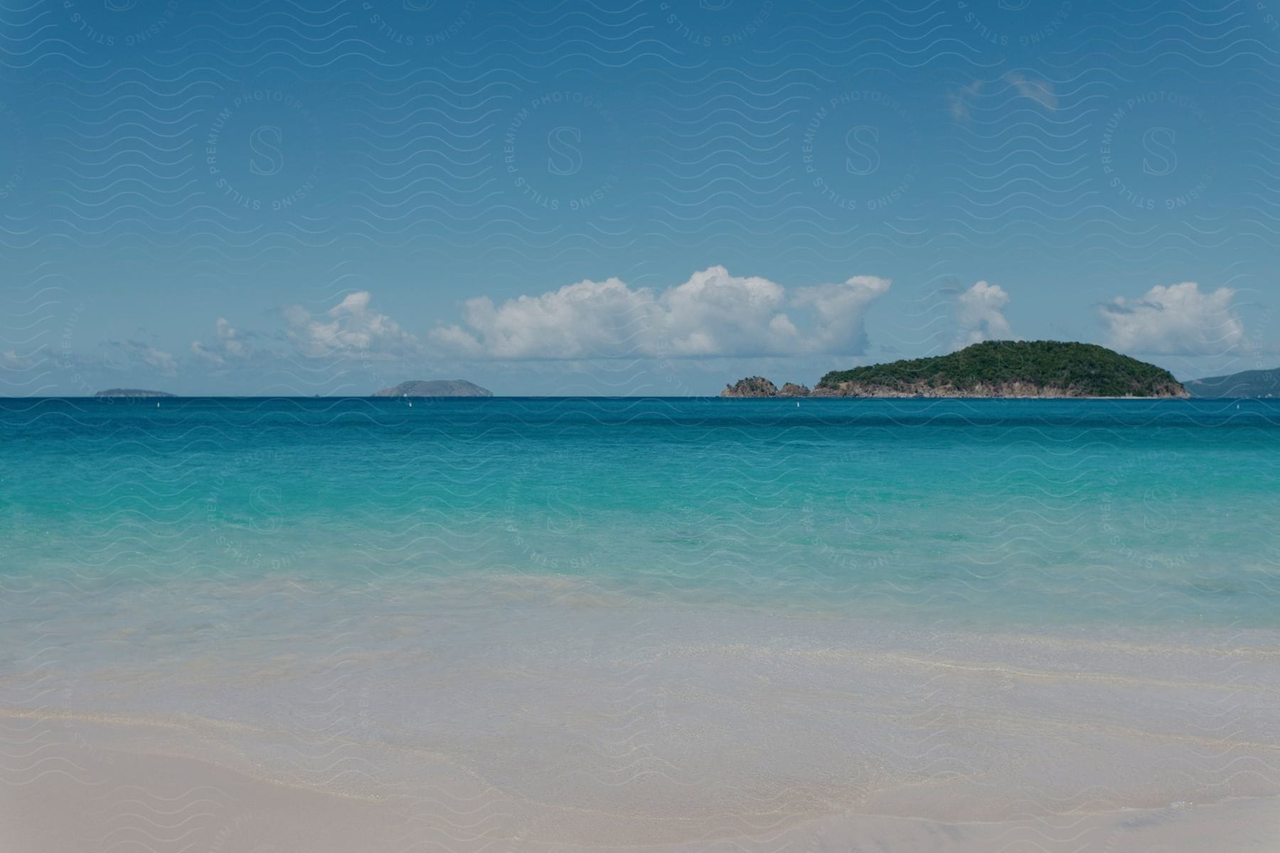 an island far away which can be seen from a beach