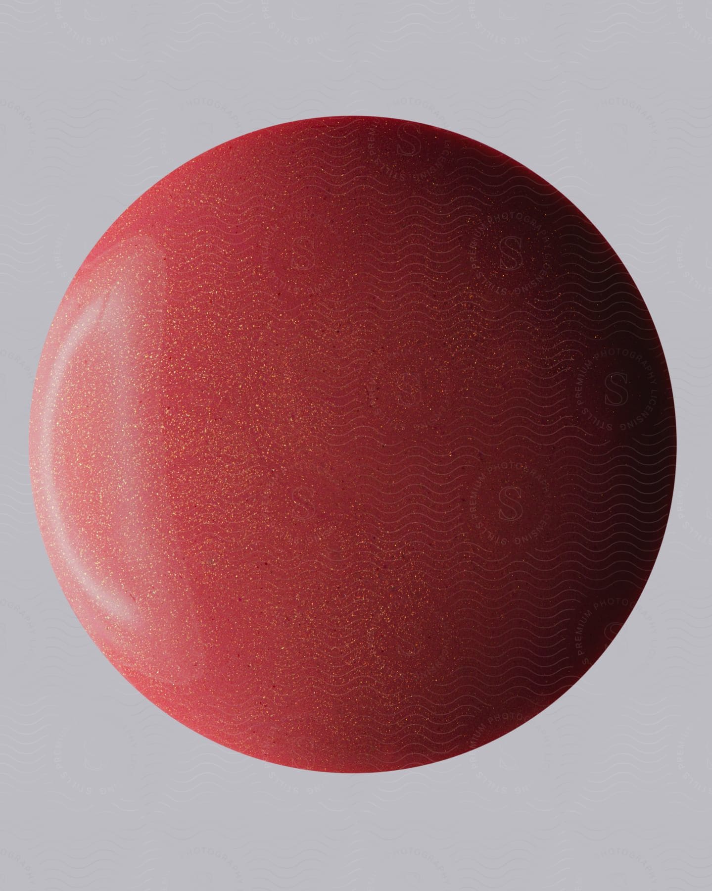 A red sphere with glowing dots.