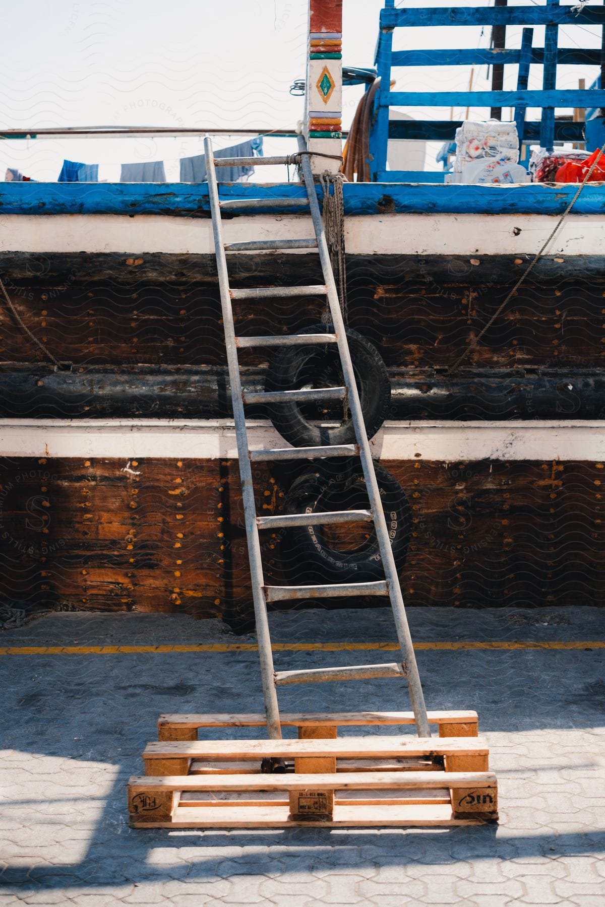 A clip of a ladder and pallet close to a ship