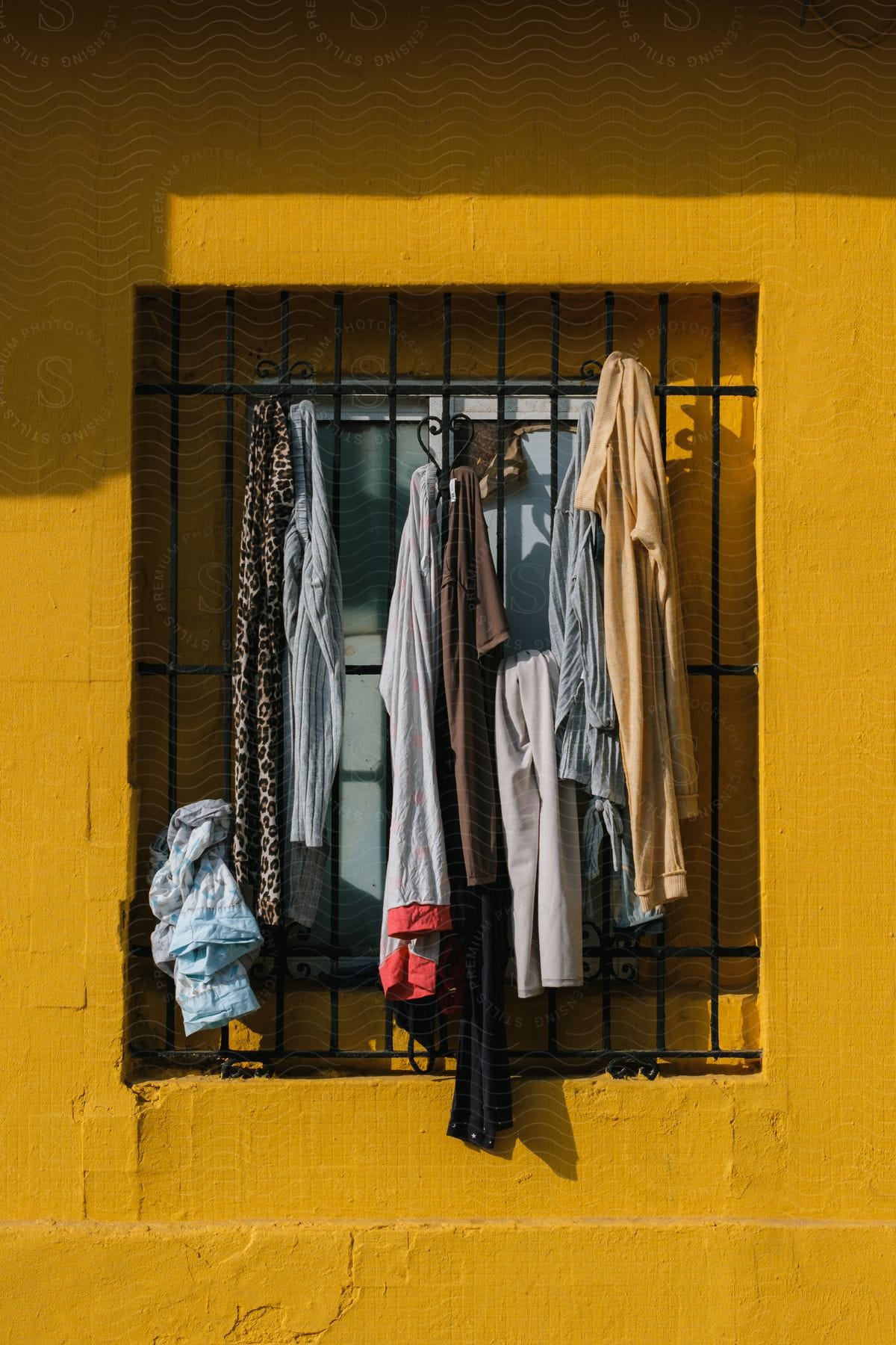 A portrait of cloths hanged on the window