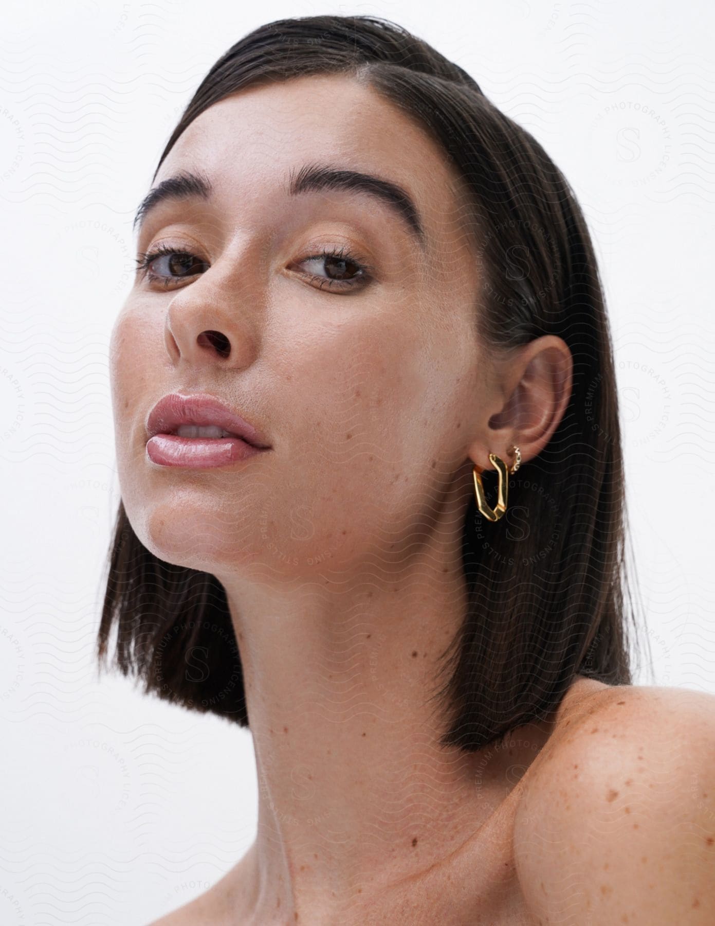 A portrait of a woman in a photography studio.