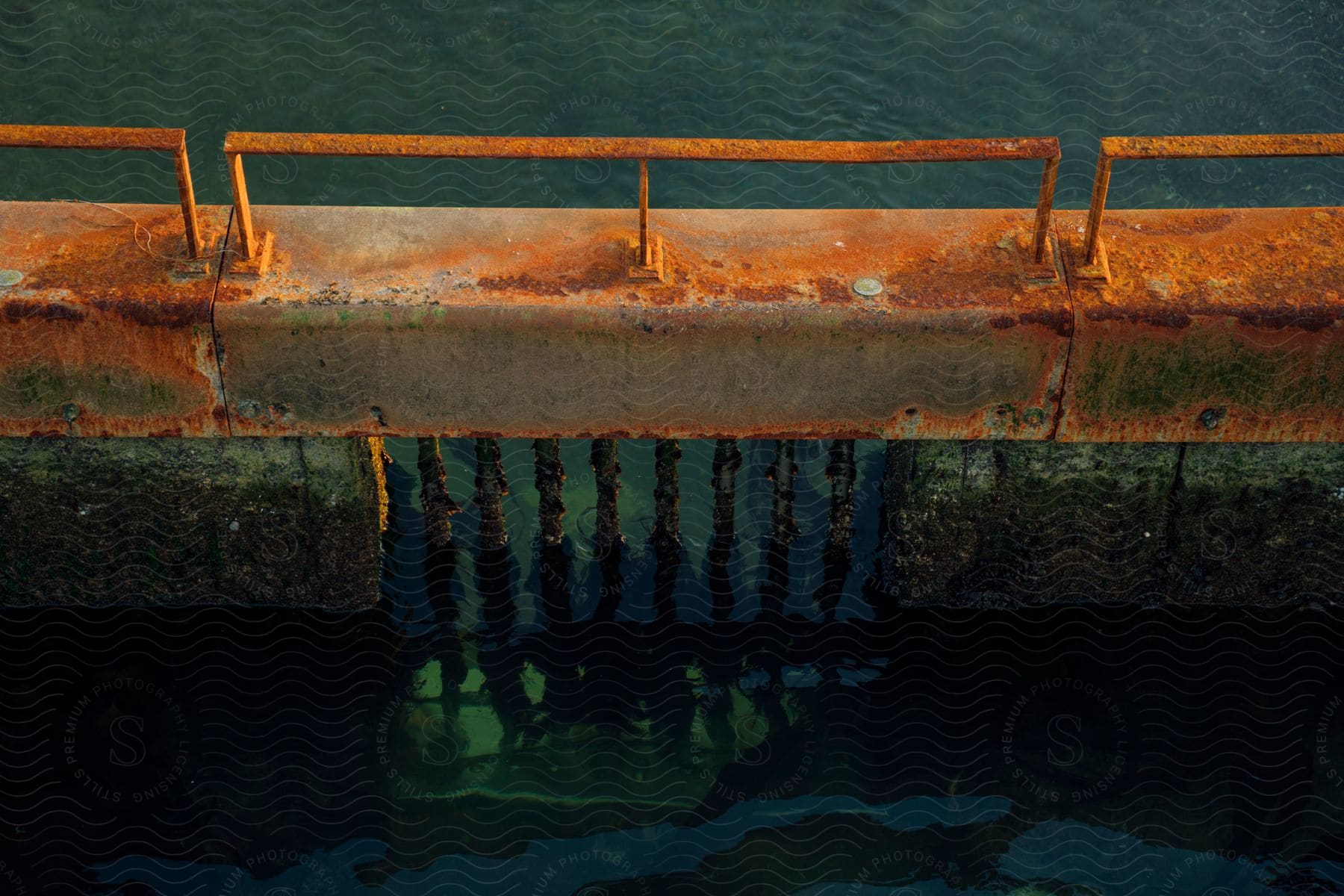 Cement structure across water with bars below